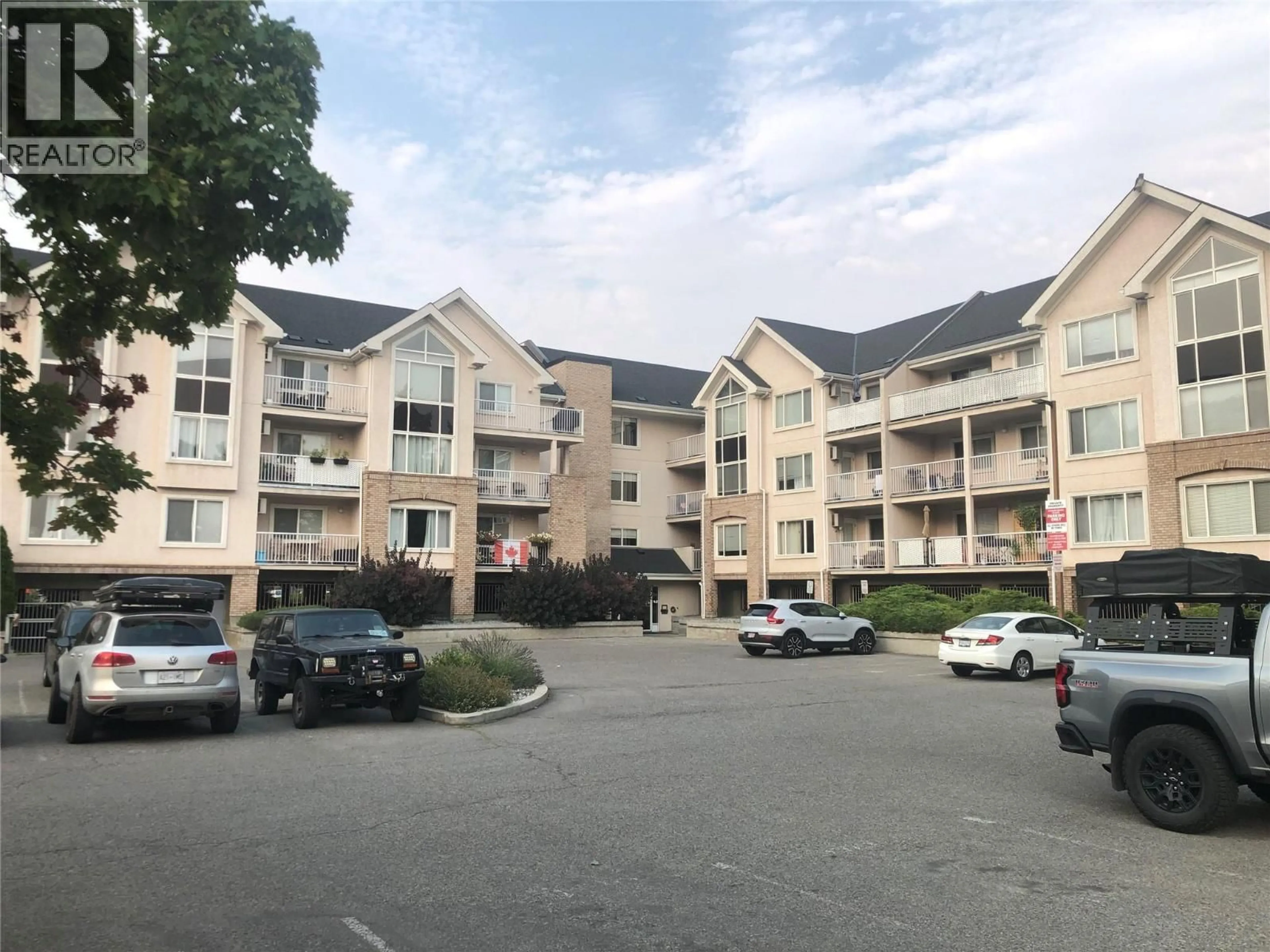 A pic from outside/outdoor area/front of a property/back of a property/a pic from drone, mountain view for 310 - 400 SUTTON CRESCENT, Kelowna British Columbia V1V1Y3