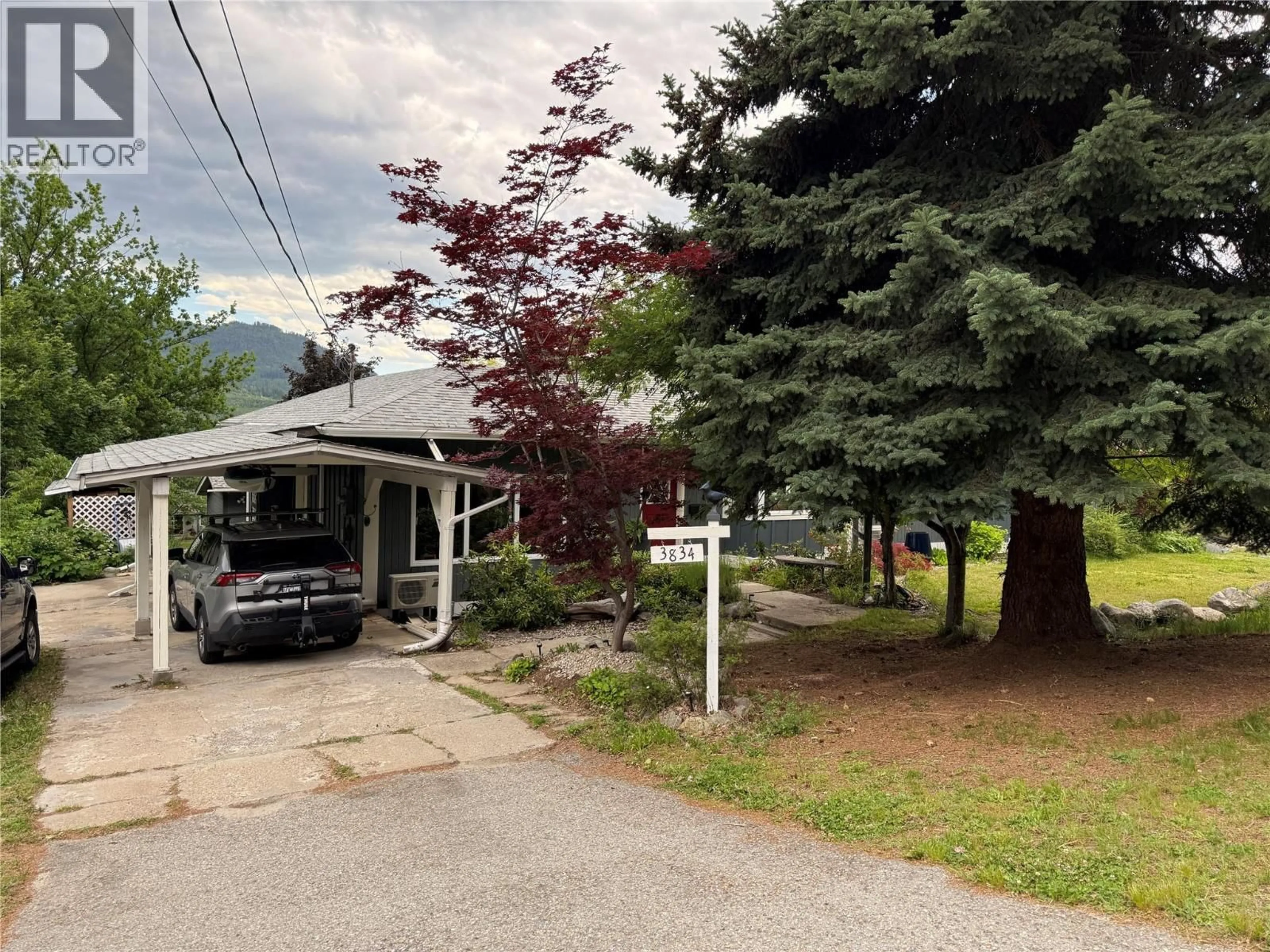 A pic from outside/outdoor area/front of a property/back of a property/a pic from drone, mountain view for 3834 WOODCREST ROAD, Bonnington British Columbia V0G2G3