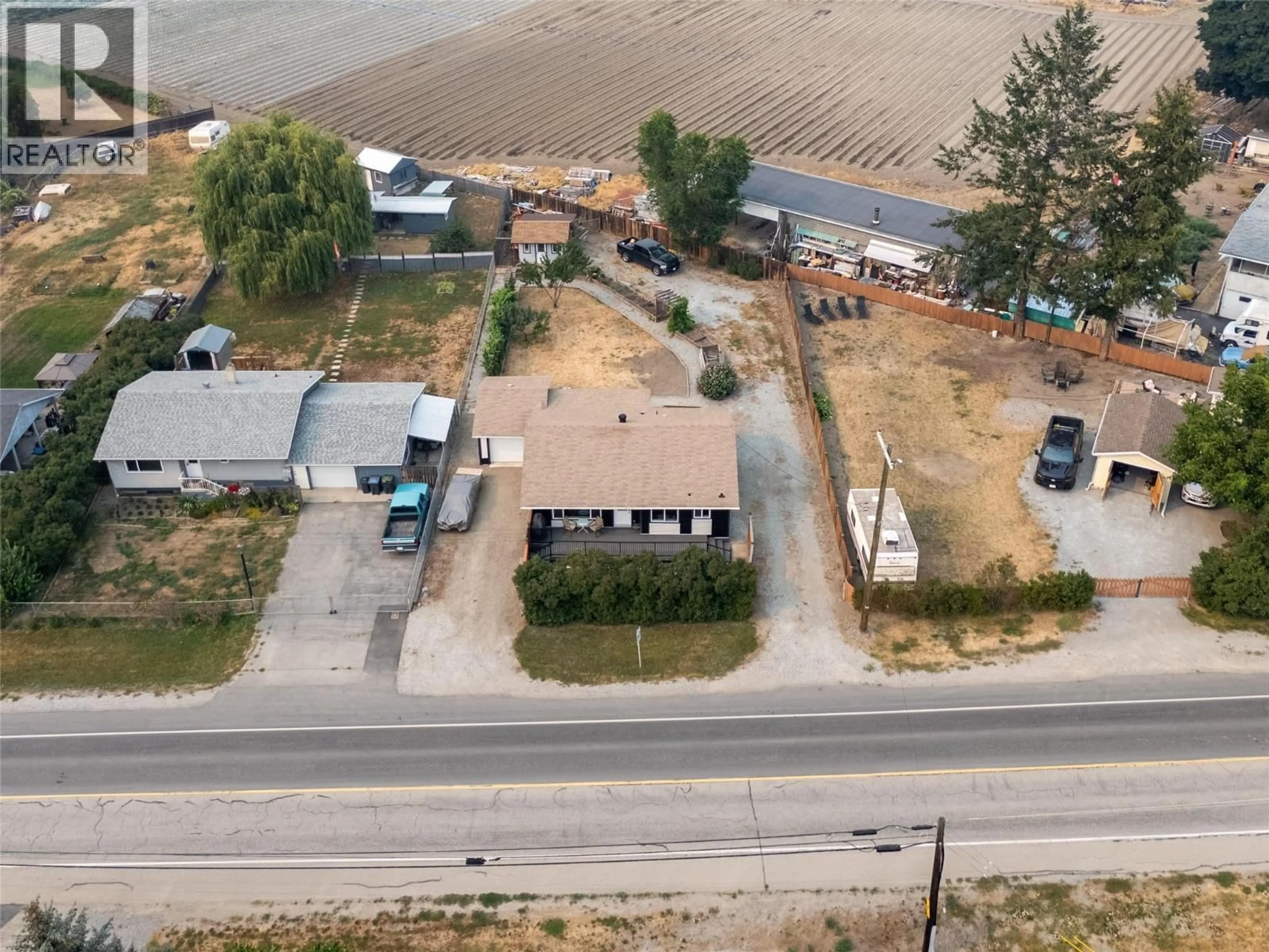 A pic from outside/outdoor area/front of a property/back of a property/a pic from drone, street for 292 VALLEY ROAD NORTH, Kelowna British Columbia V1V2G1