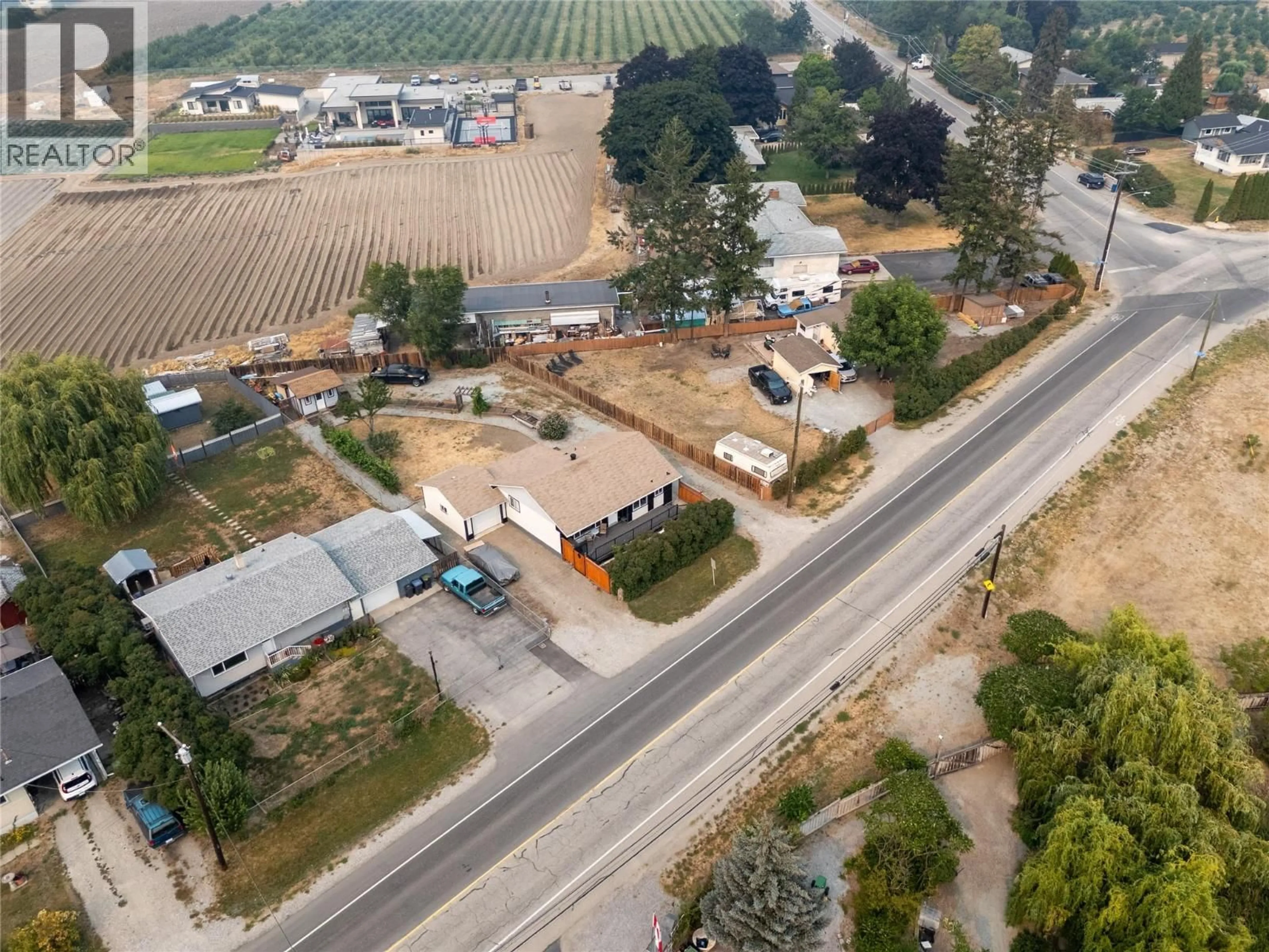A pic from outside/outdoor area/front of a property/back of a property/a pic from drone, street for 292 VALLEY ROAD NORTH, Kelowna British Columbia V1V2G1