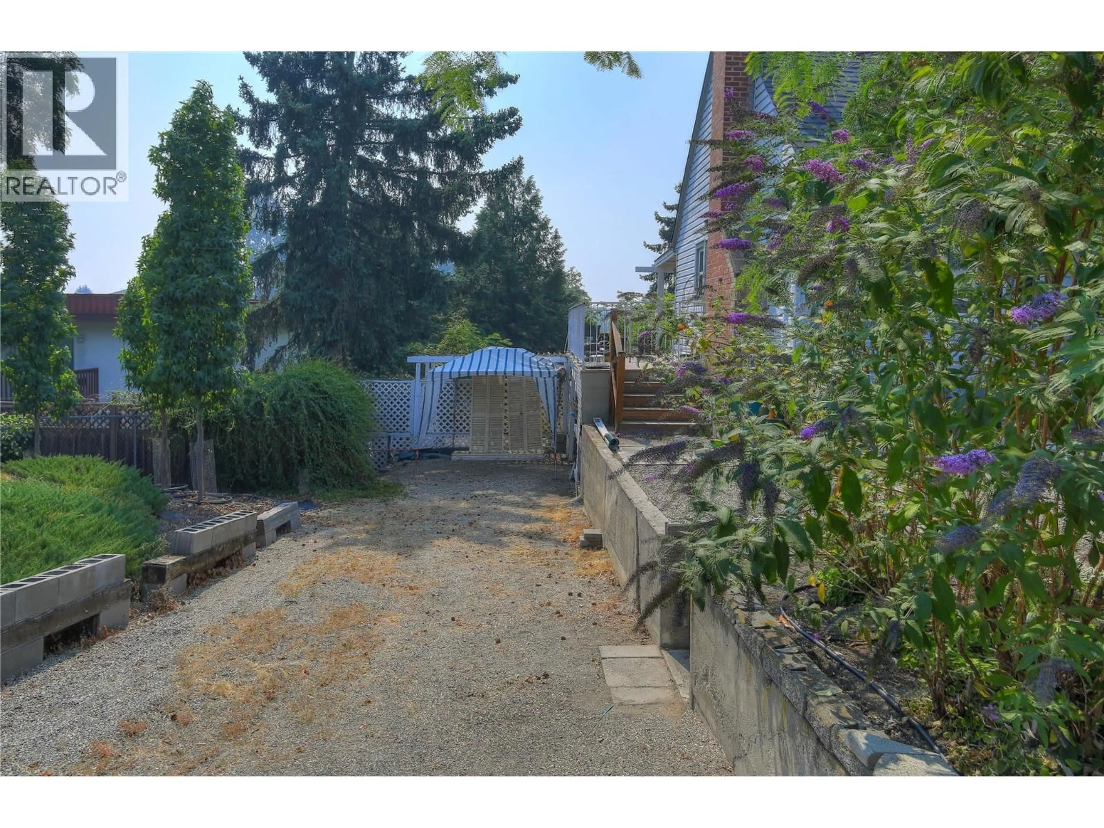 A pic from outside/outdoor area/front of a property/back of a property/a pic from drone, street for 1424 BANKHEAD CRESCENT, Kelowna British Columbia V1Y3V5