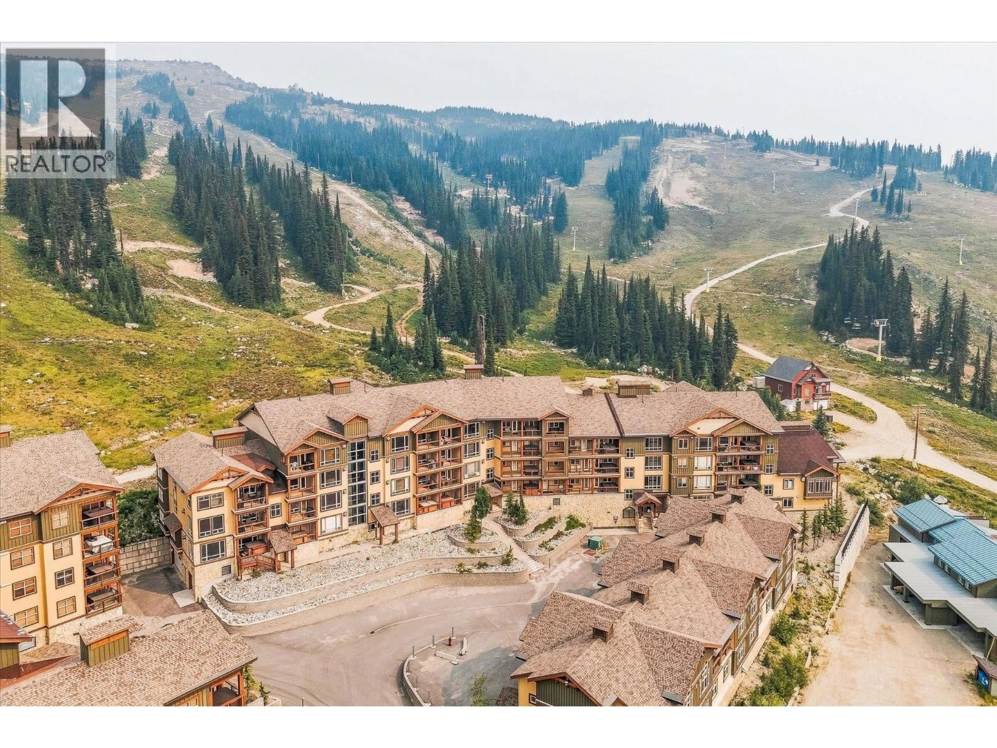 A pic from outside/outdoor area/front of a property/back of a property/a pic from drone, mountain view for 306 - 7700 PORCUPINE ROAD, Big White British Columbia V1P1T4