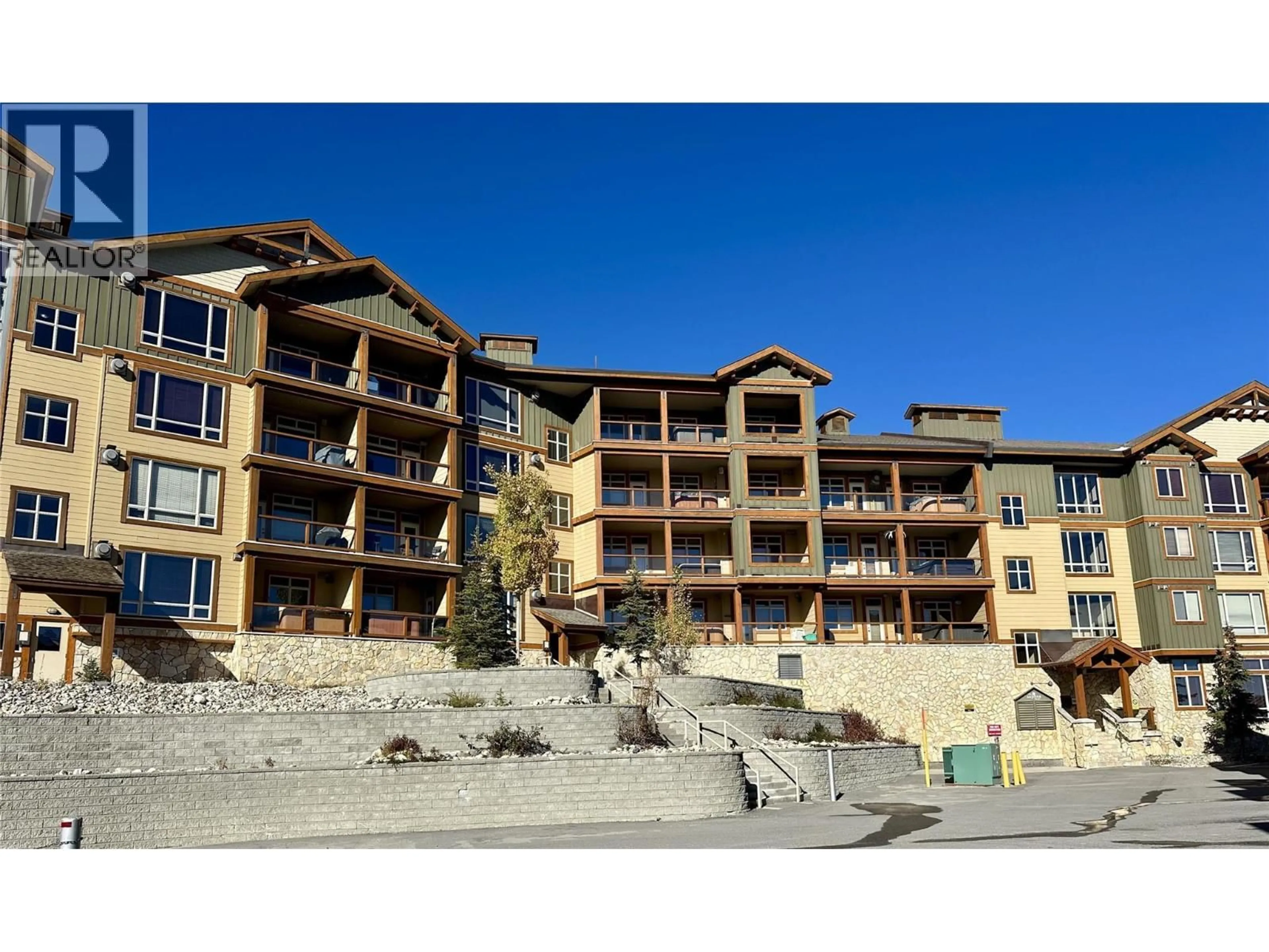 A pic from outside/outdoor area/front of a property/back of a property/a pic from drone, building for 306 - 7700 PORCUPINE ROAD, Big White British Columbia V1P1T4
