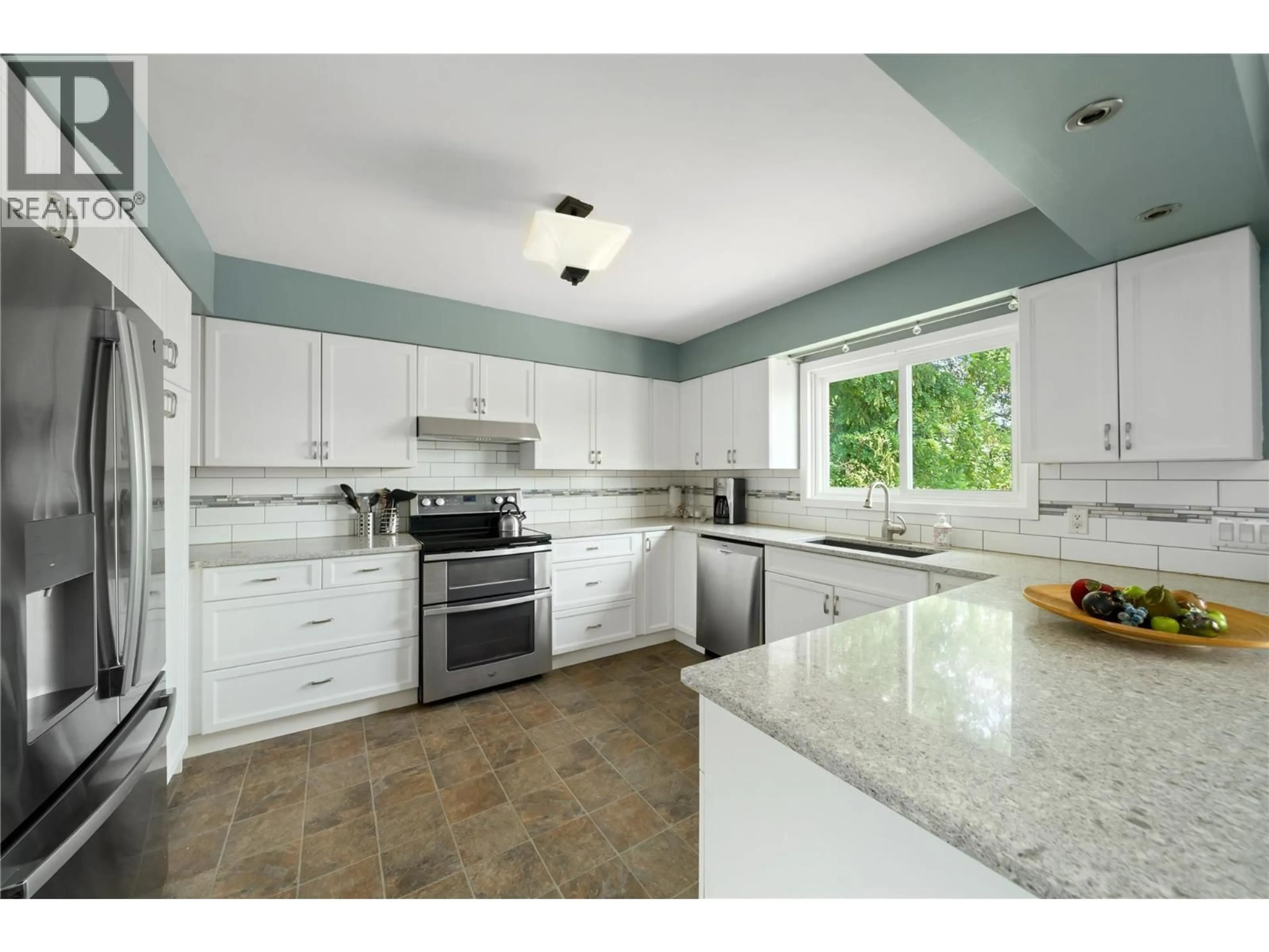 Open concept kitchen, ceramic/tile floor for 597 BINNS STREET, Trail British Columbia V1R3L3