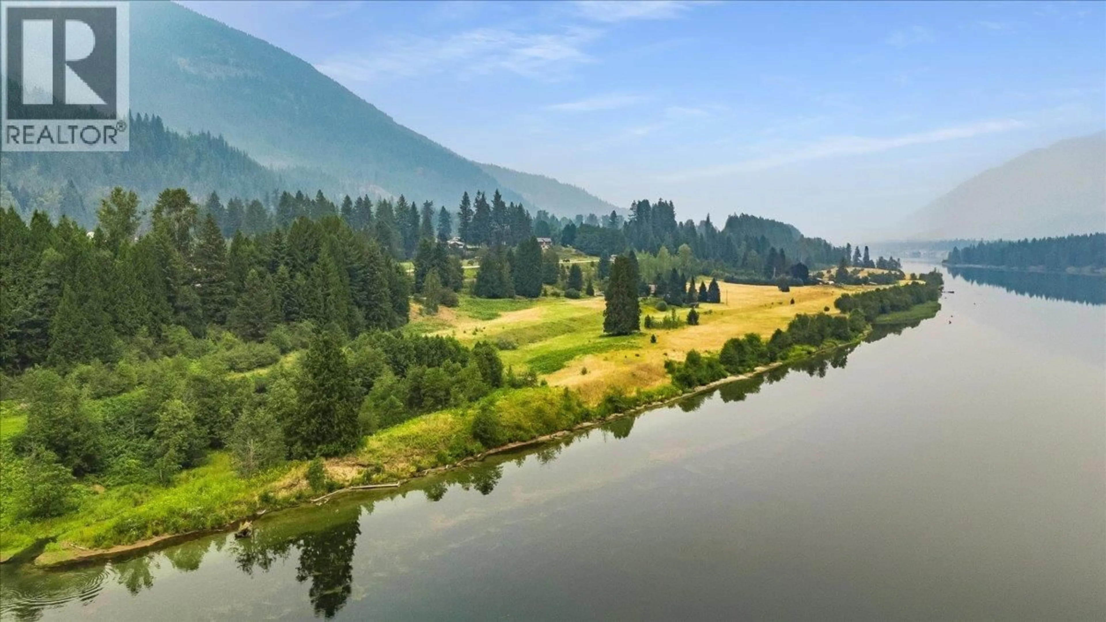 A pic from outside/outdoor area/front of a property/back of a property/a pic from drone, water/lake/river/ocean view for 1864 HIGHWAY 3A OTHER, Castlegar British Columbia V1N4N6