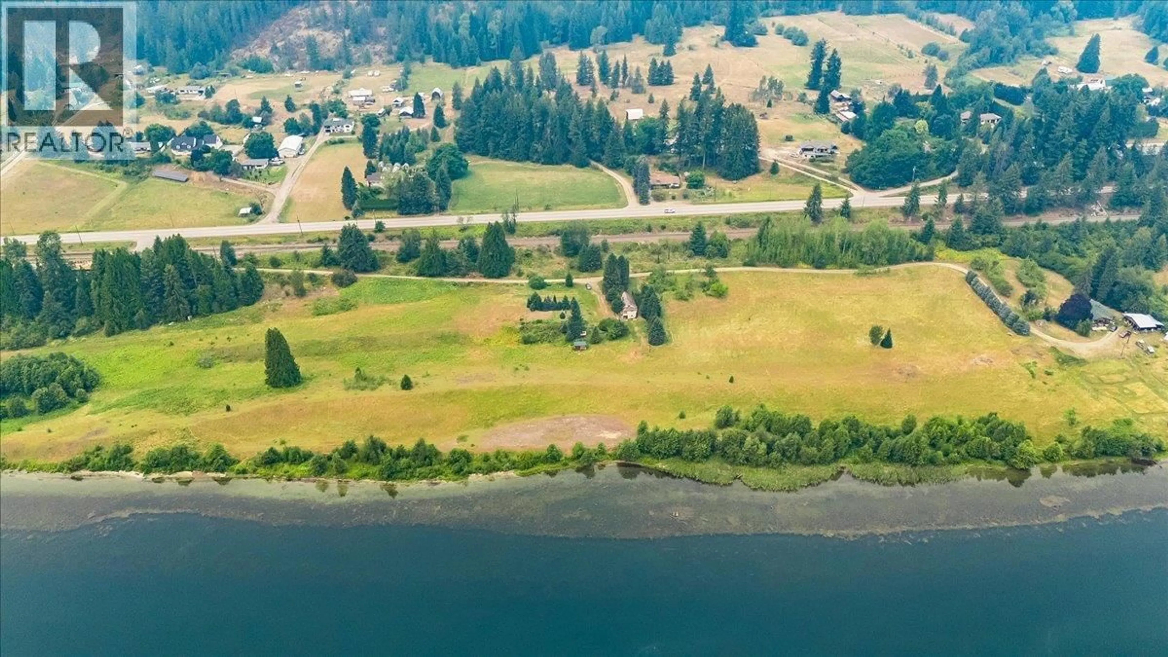 A pic from outside/outdoor area/front of a property/back of a property/a pic from drone, water/lake/river/ocean view for 1864 HIGHWAY 3A OTHER, Castlegar British Columbia V1N4N6