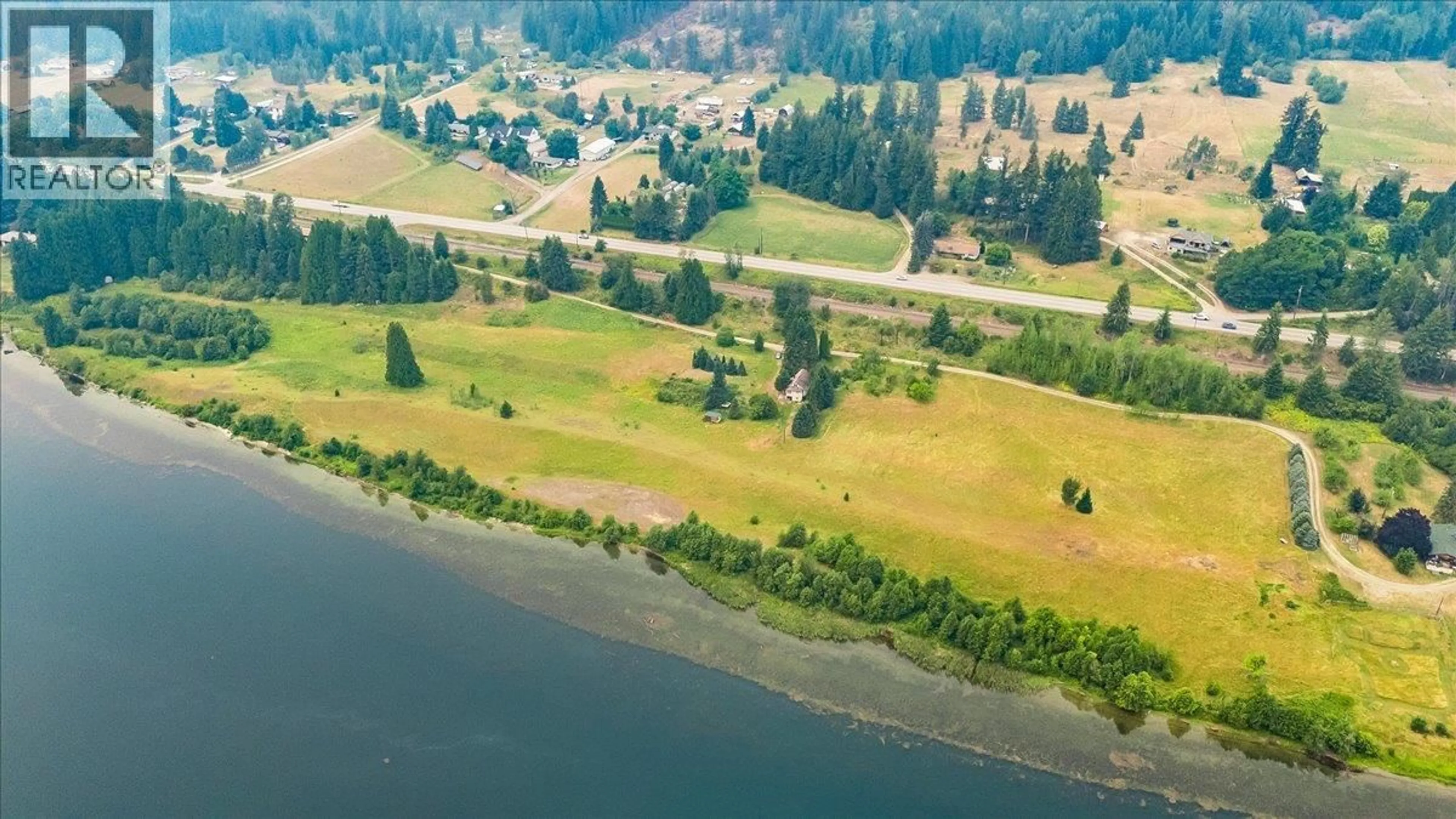 A pic from outside/outdoor area/front of a property/back of a property/a pic from drone, water/lake/river/ocean view for 1864 HIGHWAY 3A OTHER, Castlegar British Columbia V1N4N6