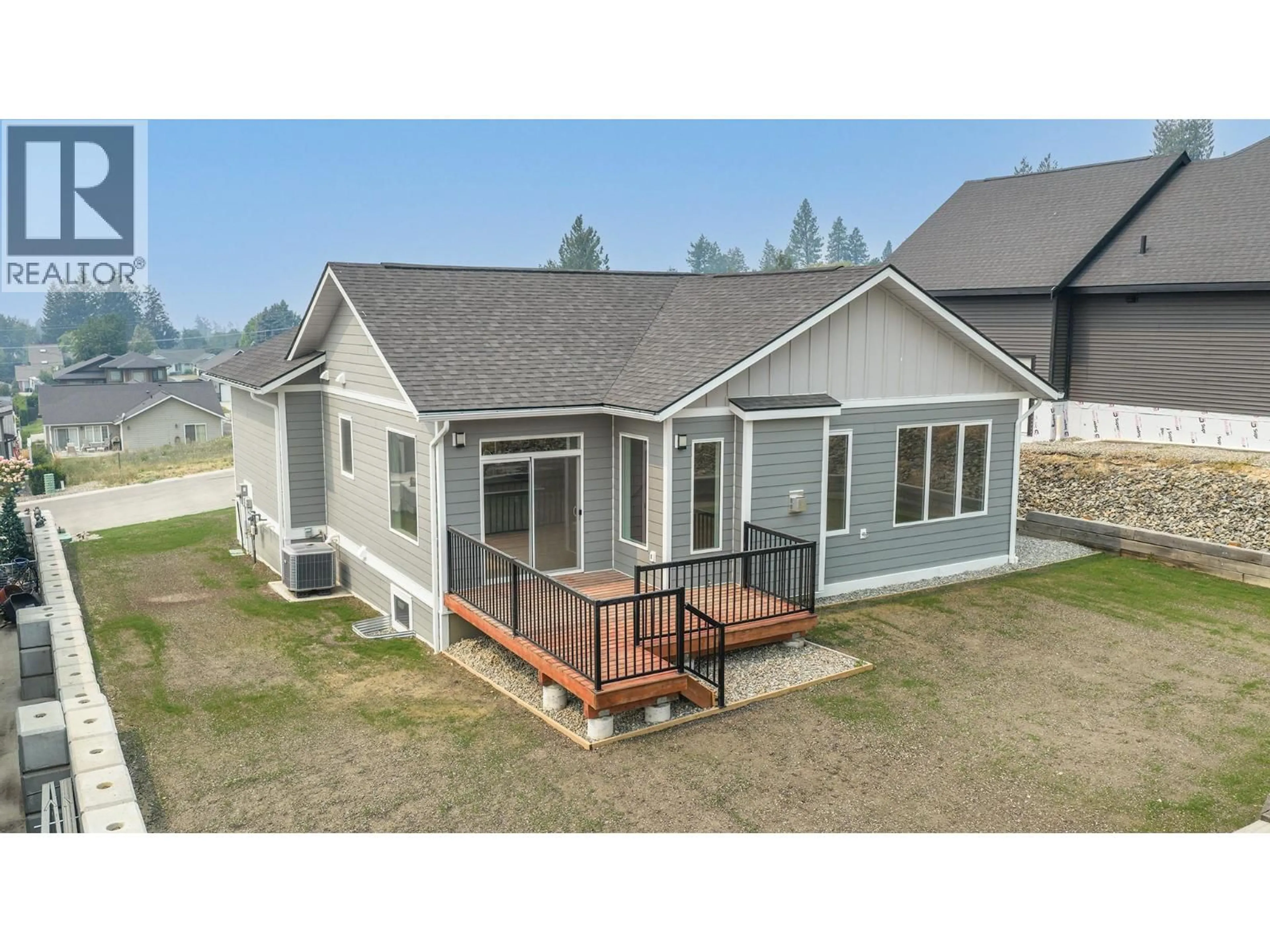 A pic from outside/outdoor area/front of a property/back of a property/a pic from drone, unknown for 712 MOUNTAIN VIEW CRESCENT, Creston British Columbia V0B1G5