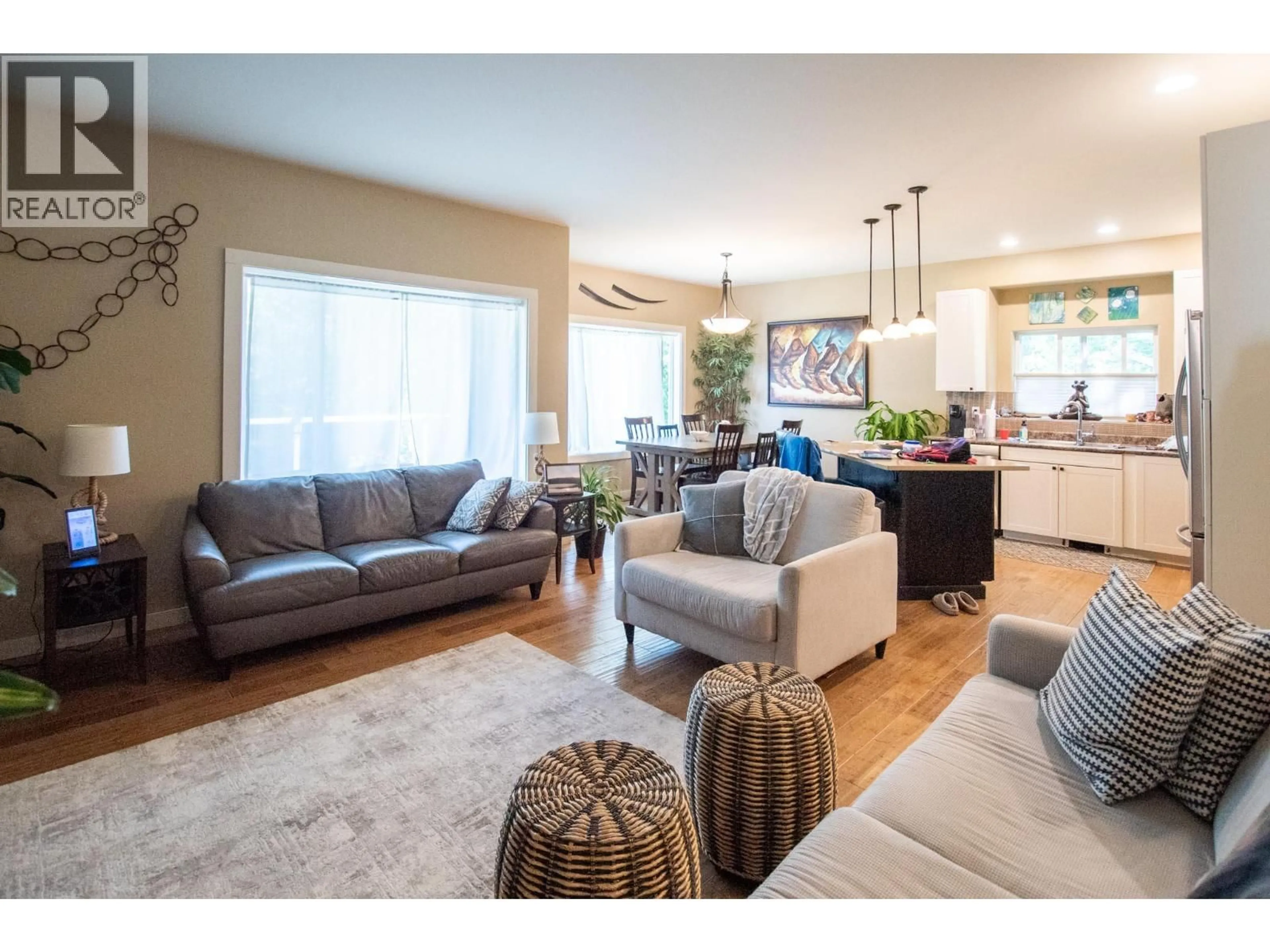 Living room with furniture, wood/laminate floor for 206 MURTLE ROAD, Clearwater British Columbia V0E1N1