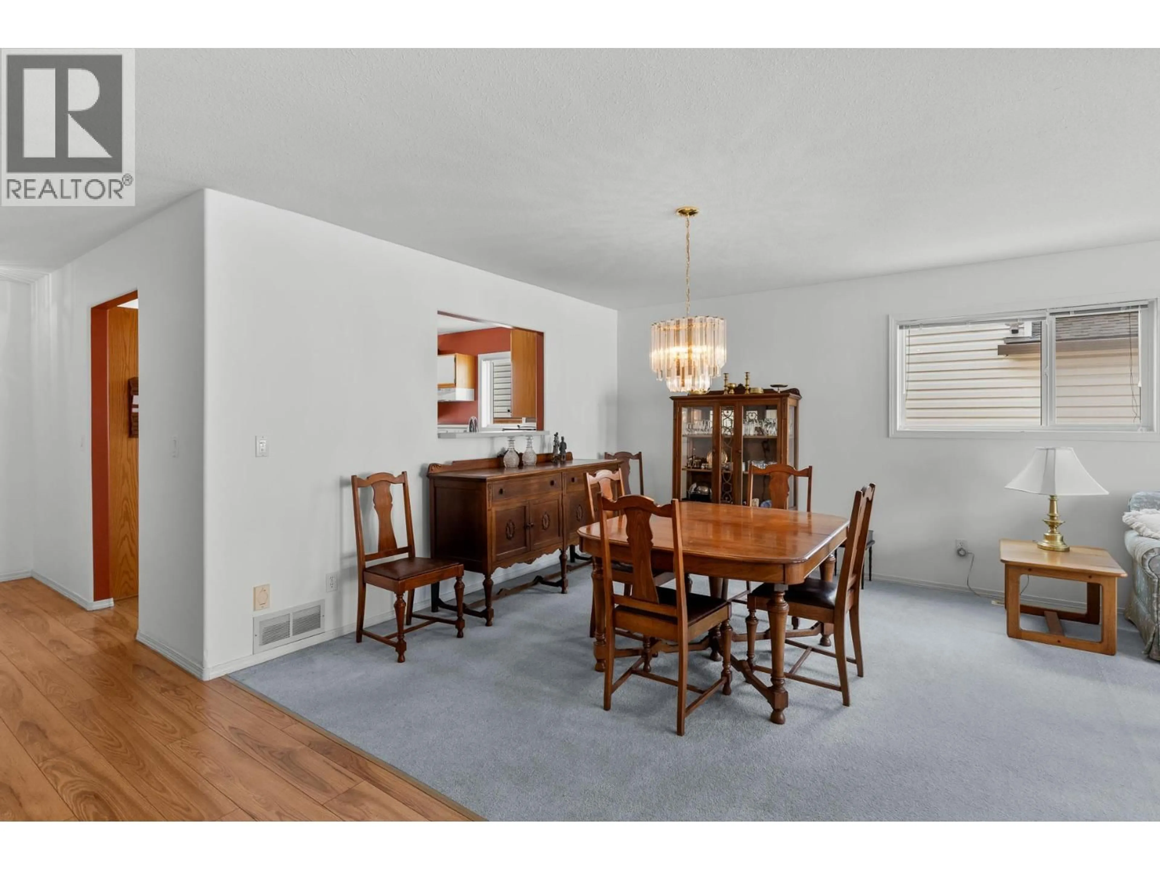 Dining room, wood/laminate floor for 27 - 555 GLENMEADOWS ROAD, Kelowna British Columbia V1V1V5