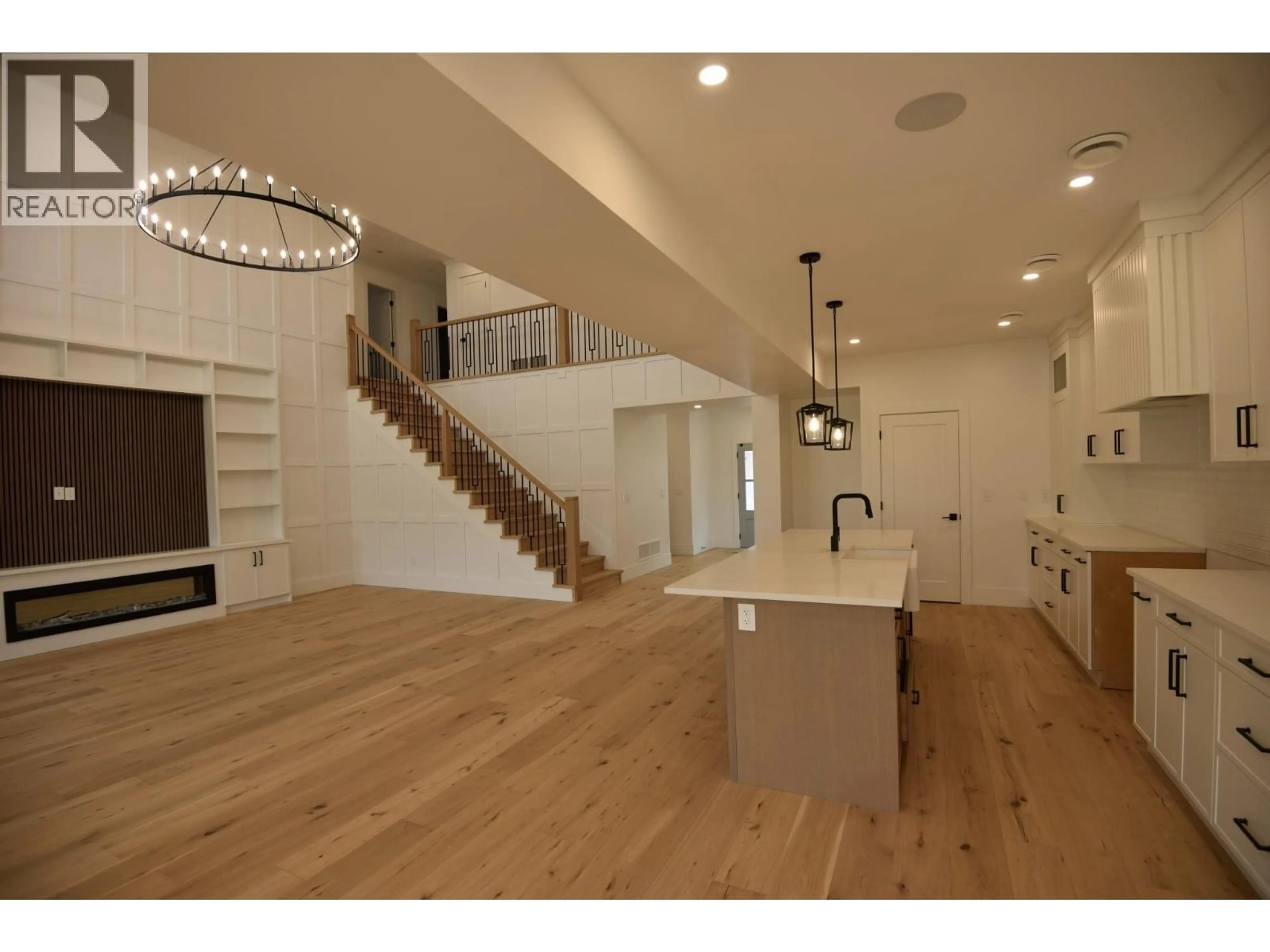 Open concept kitchen, wood/laminate floor for 18 CHARDONNAY COURT, Osoyoos British Columbia V0H1V6