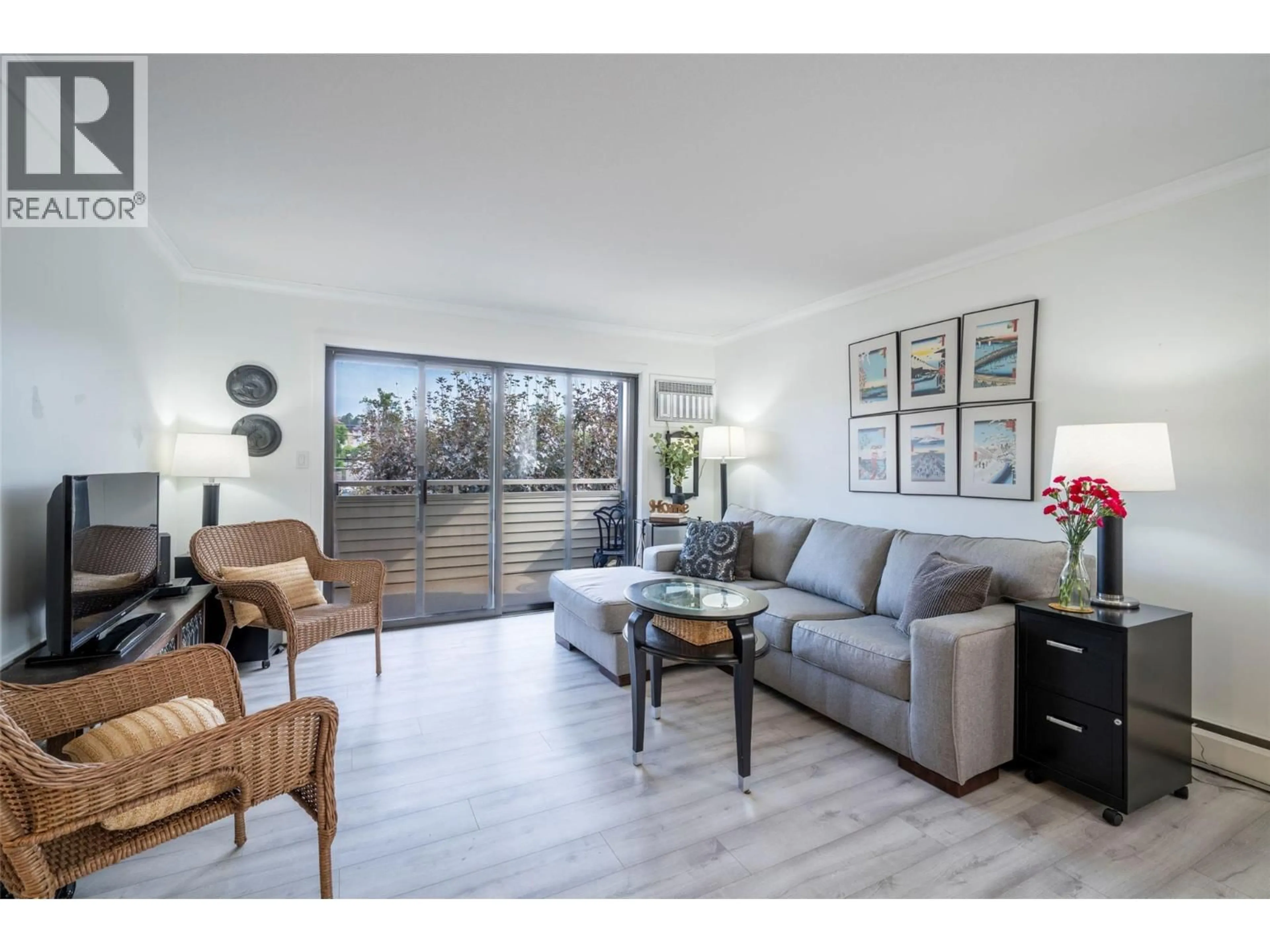 Living room with furniture, wood/laminate floor for 209 - 3608 27 AVENUE, Vernon British Columbia V1T1S4