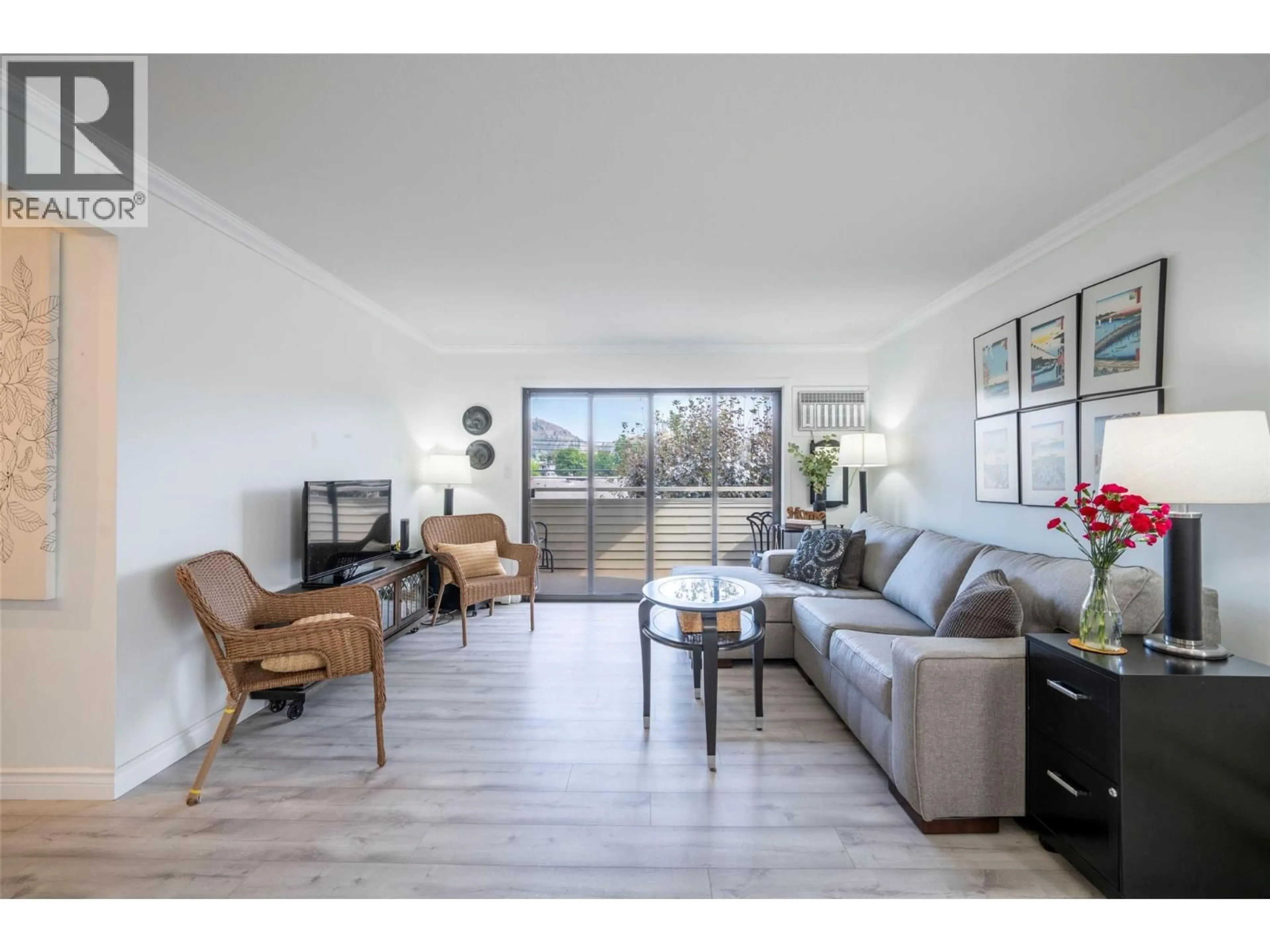 Living room with furniture, wood/laminate floor for 209 - 3608 27 AVENUE, Vernon British Columbia V1T1S4