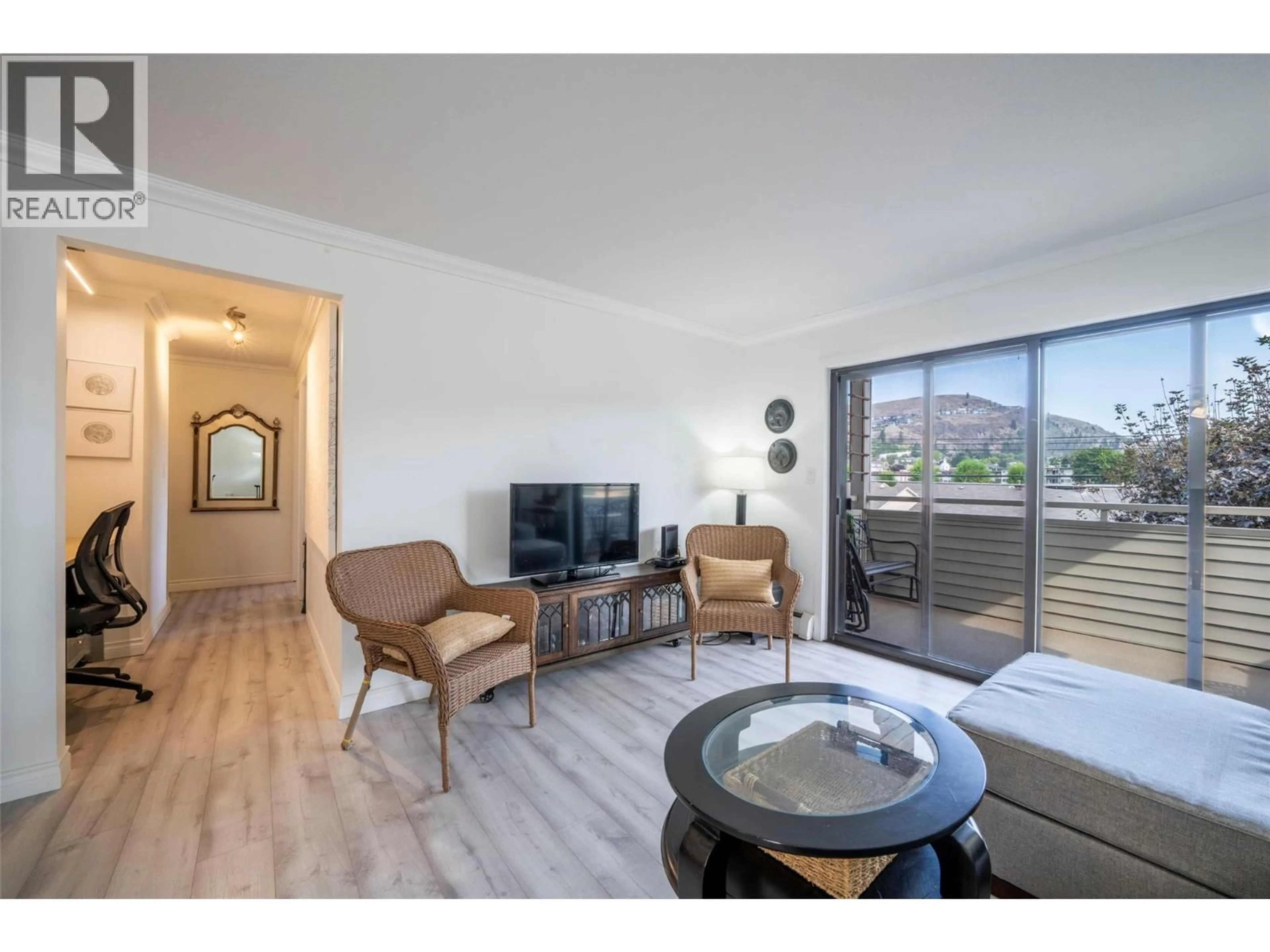 Living room with furniture, wood/laminate floor for 209 - 3608 27 AVENUE, Vernon British Columbia V1T1S4