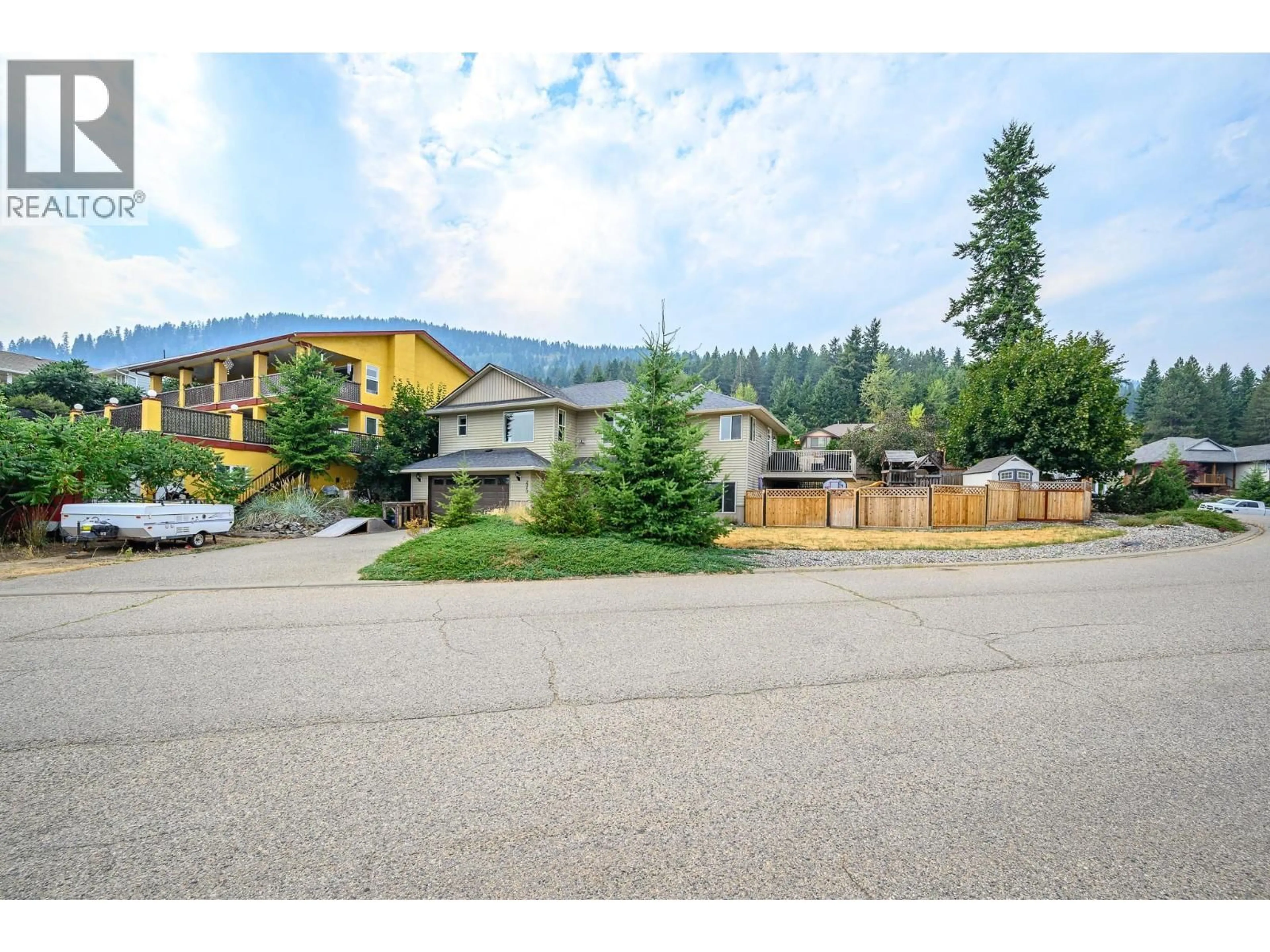 A pic from outside/outdoor area/front of a property/back of a property/a pic from drone, mountain view for 2040 SKYVIEW CRESCENT, Lumby British Columbia V0E2G0