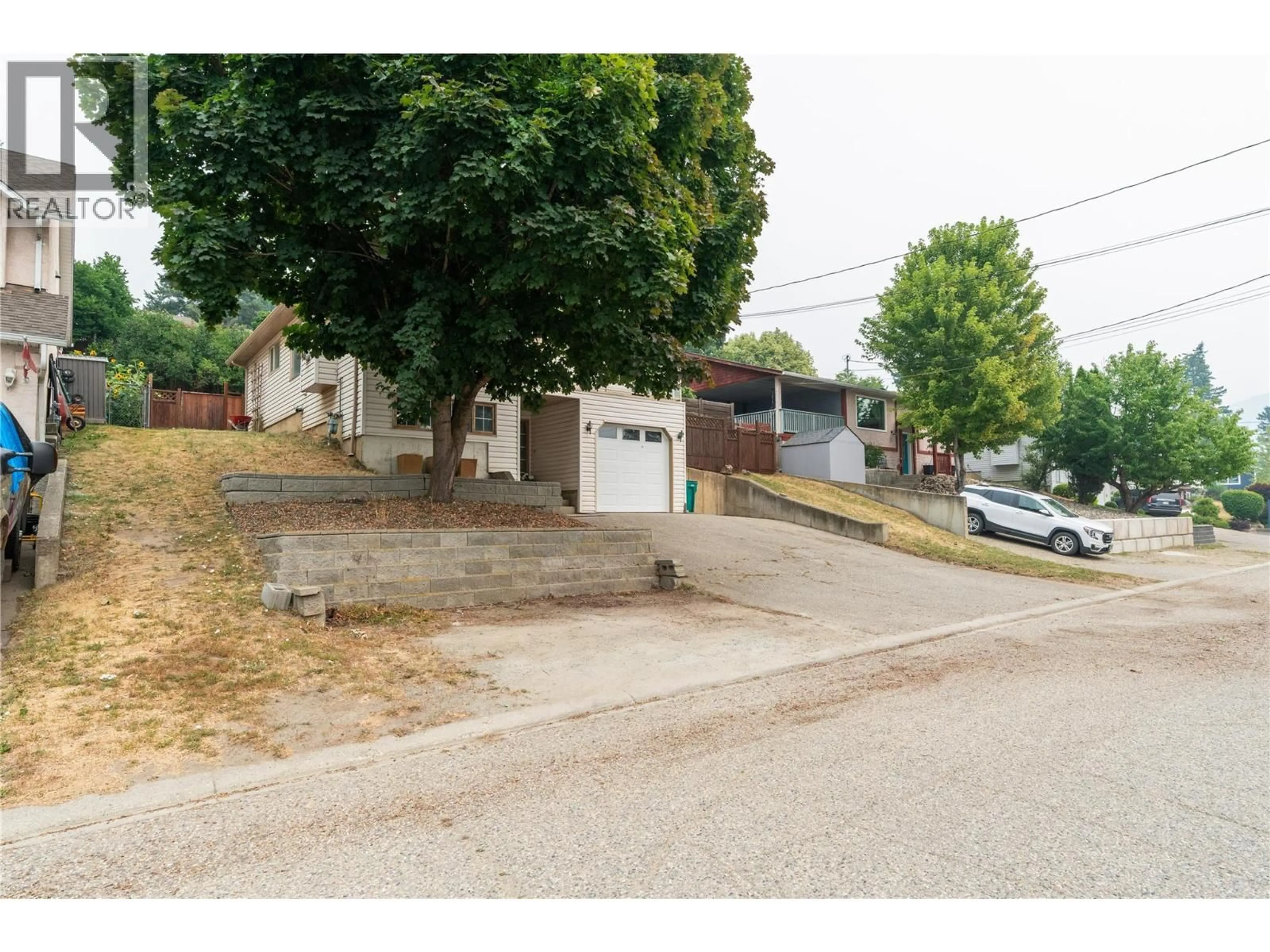 A pic from outside/outdoor area/front of a property/back of a property/a pic from drone, street for 1908 GRANDVIEW AVENUE, Lumby British Columbia V0E2G0
