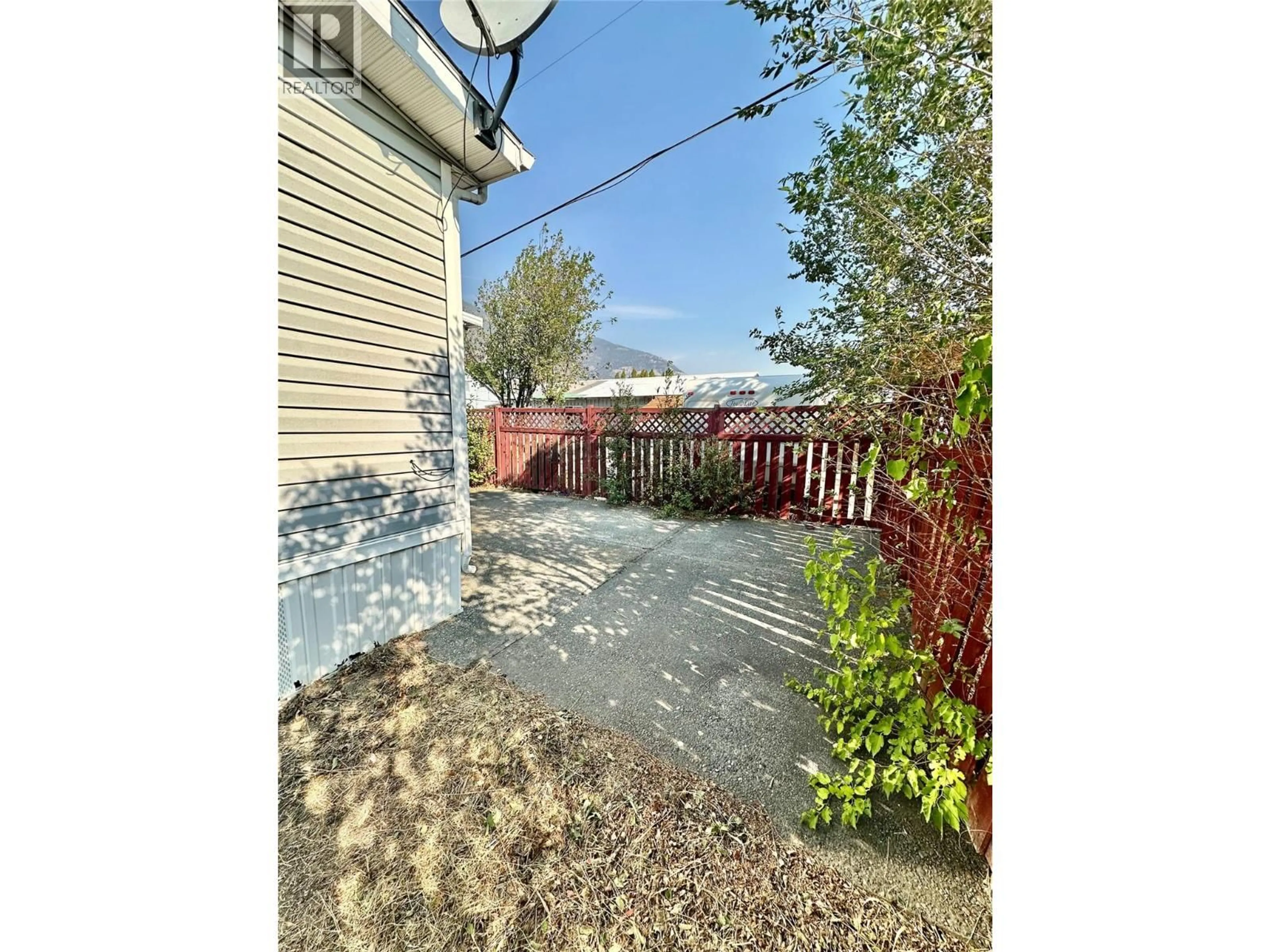 A pic from outside/outdoor area/front of a property/back of a property/a pic from drone, street for 908 BLAKEBOROUGH AVENUE, Keremeos British Columbia V0X1N2