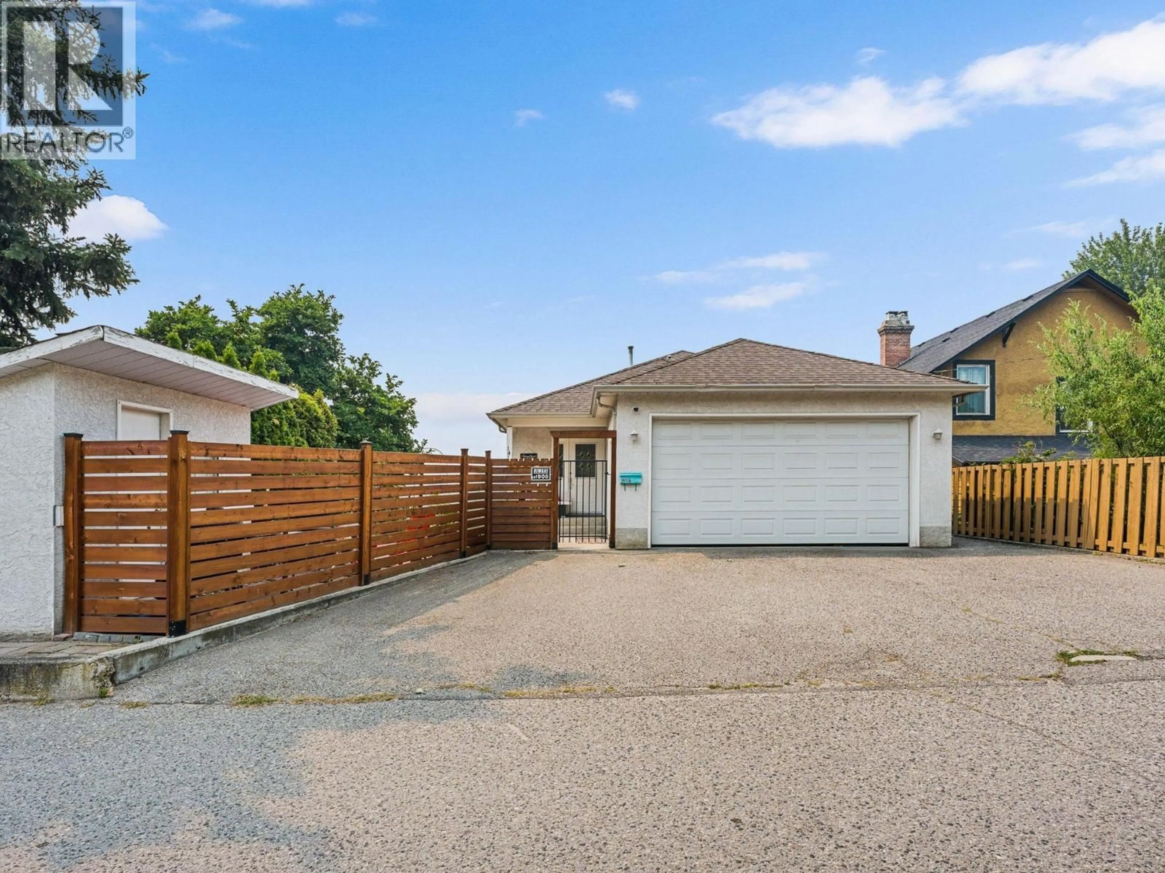 A pic from outside/outdoor area/front of a property/back of a property/a pic from drone, street for 1412 LAWRENCE AVENUE, Kelowna British Columbia V1Y6M8