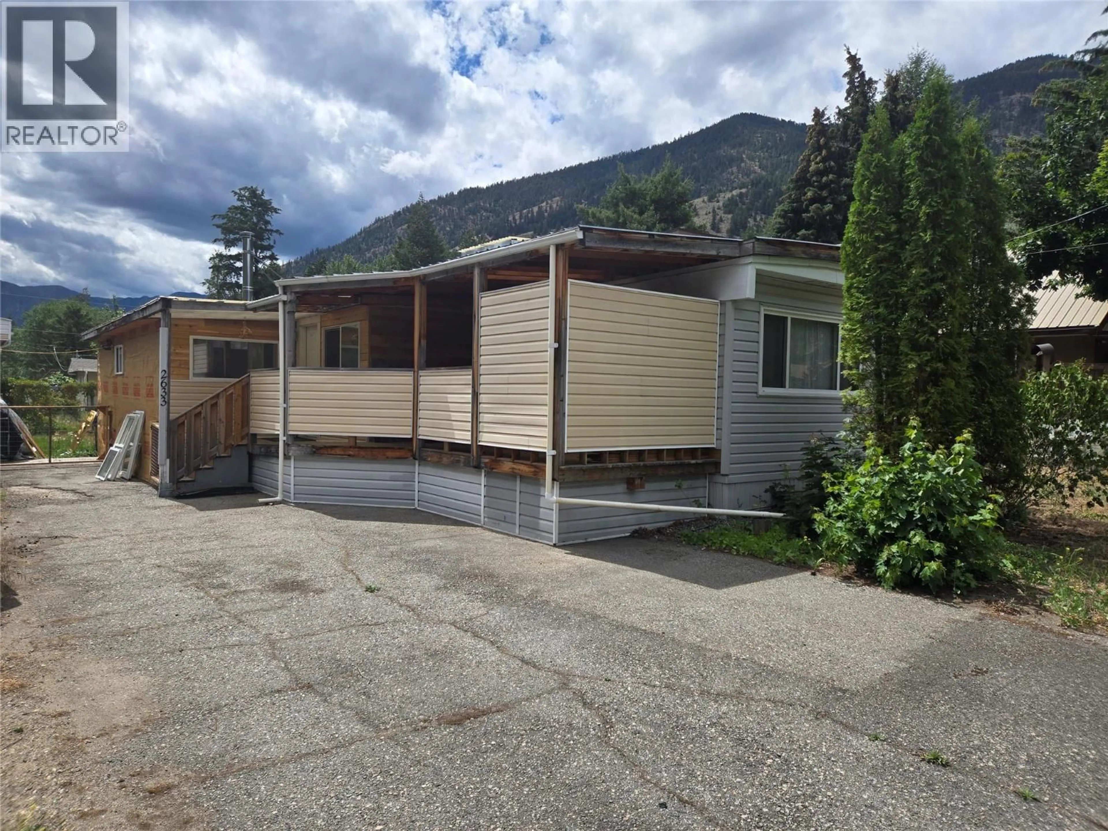 Home with vinyl exterior material, mountain view for 2633 5TH STREET, Olalla British Columbia V0X1N6