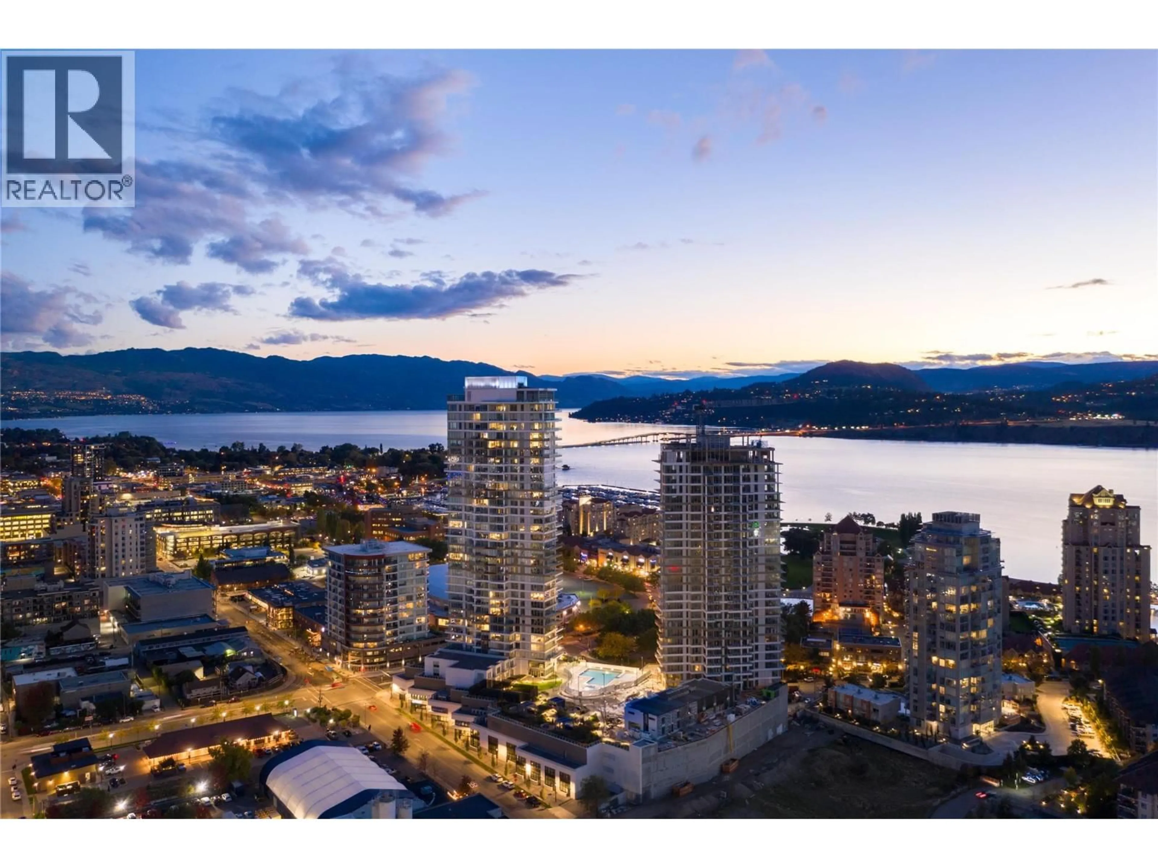 A pic from outside/outdoor area/front of a property/back of a property/a pic from drone, water/lake/river/ocean view for 2106 - 1191 SUNSET DRIVE, Kelowna British Columbia V1Y0J4