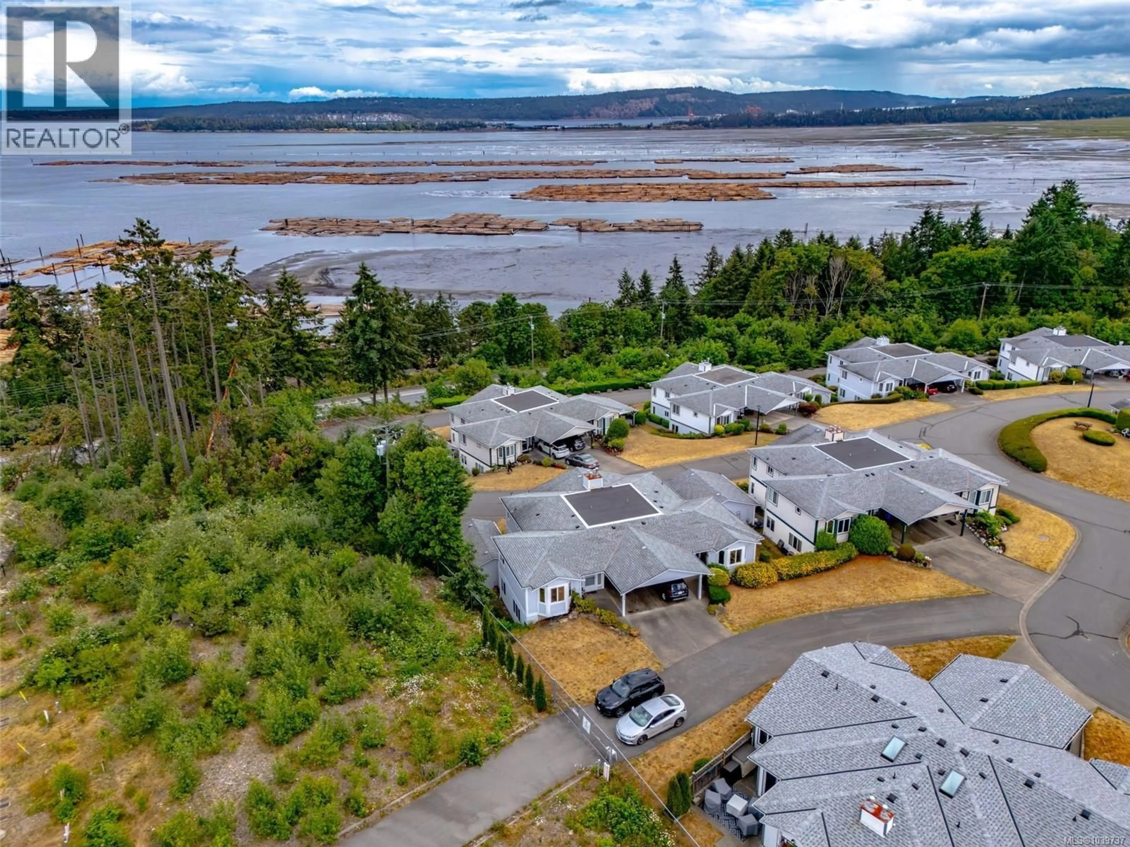 A pic from outside/outdoor area/front of a property/back of a property/a pic from drone, water/lake/river/ocean view for 398 PETROGLYPH CRESCENT, Nanaimo British Columbia V9R5K1