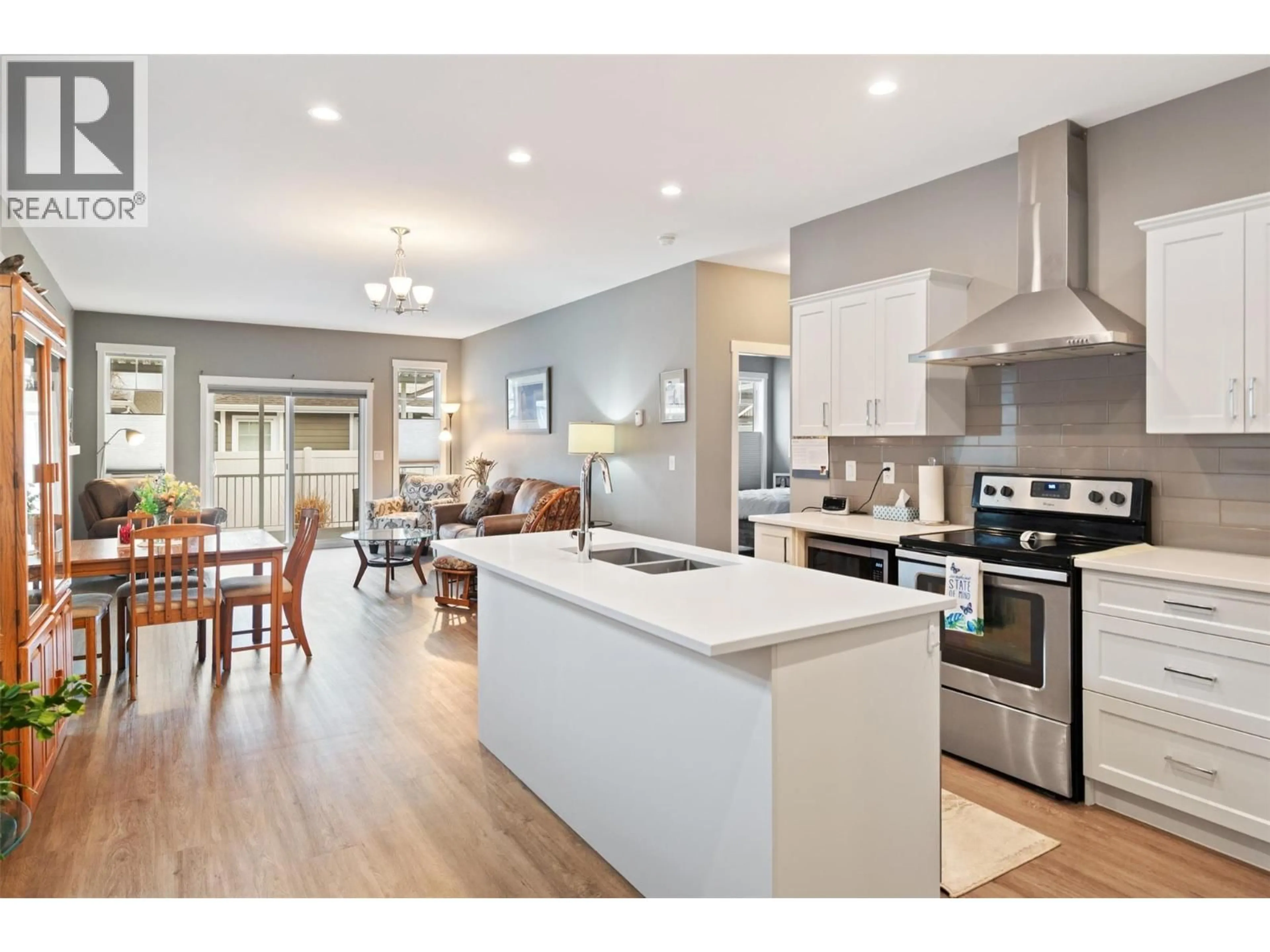 Open concept kitchen, wood/laminate floor for 42 - 351 WARREN AVENUE WEST, Penticton British Columbia V2A3N2