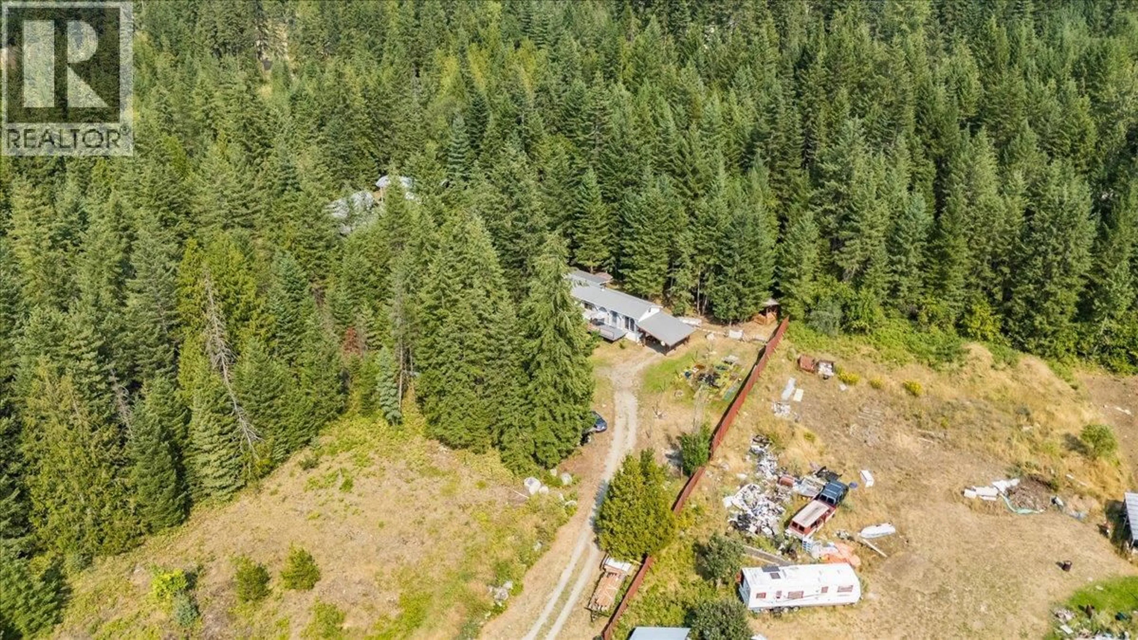 A pic from outside/outdoor area/front of a property/back of a property/a pic from drone, forest/trees view for 8864 SLOCAN S ROAD, Slocan British Columbia V0G2C0