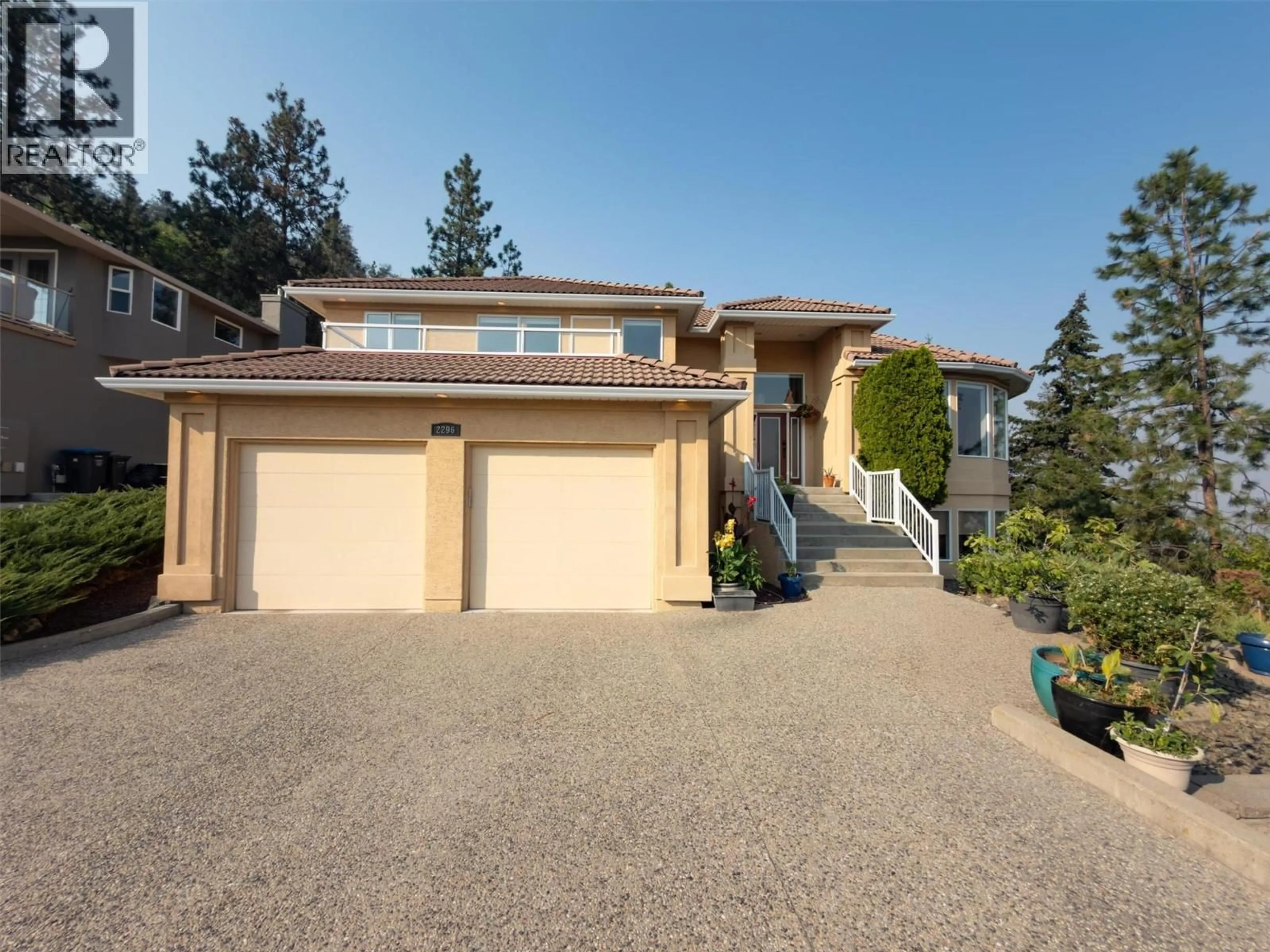 A pic from outside/outdoor area/front of a property/back of a property/a pic from drone, street for 2296 LILLOOET CRESCENT, Kelowna British Columbia V1V1T1