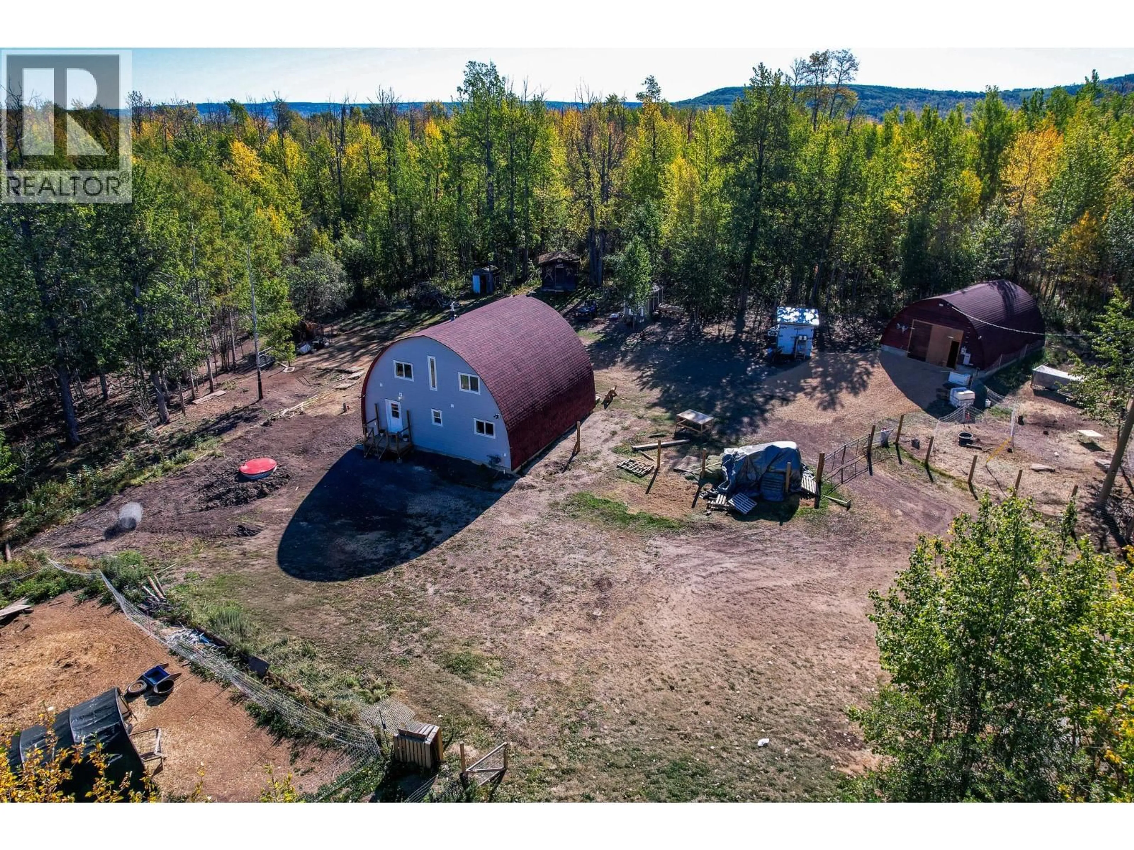 A pic from outside/outdoor area/front of a property/back of a property/a pic from drone, forest/trees view for 12094 233 ROAD, Dawson Creek British Columbia V1G4H4
