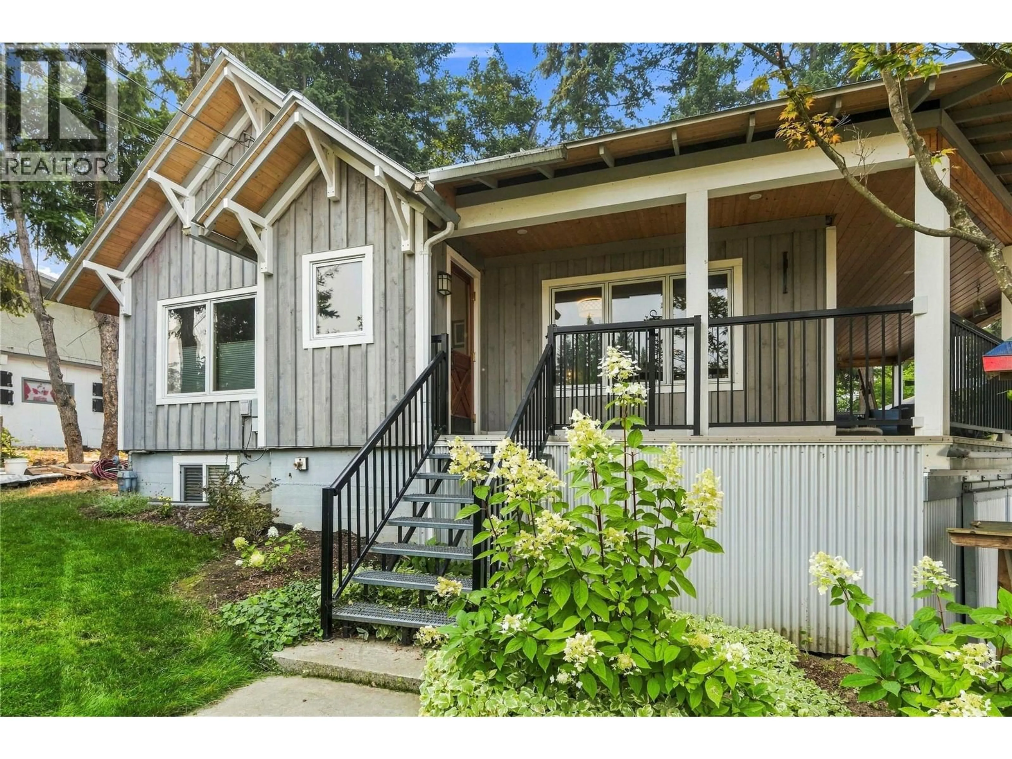 Home with vinyl exterior material, street for 1710 11 AVENUE NORTHEAST, Salmon Arm British Columbia V1E2T4