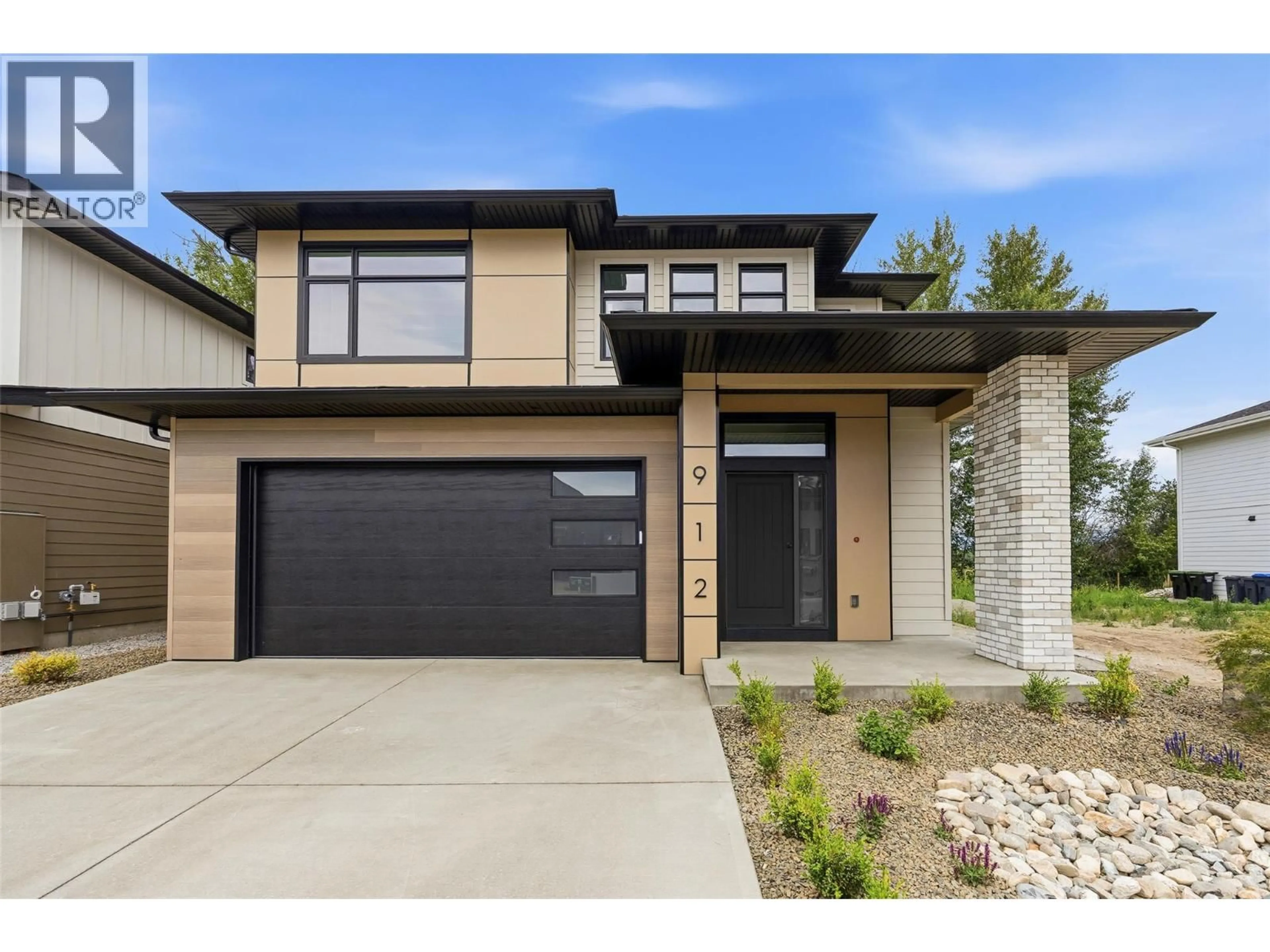 Home with brick exterior material, street for 912 BULL CRESCENT, Kelowna British Columbia V1W4N2