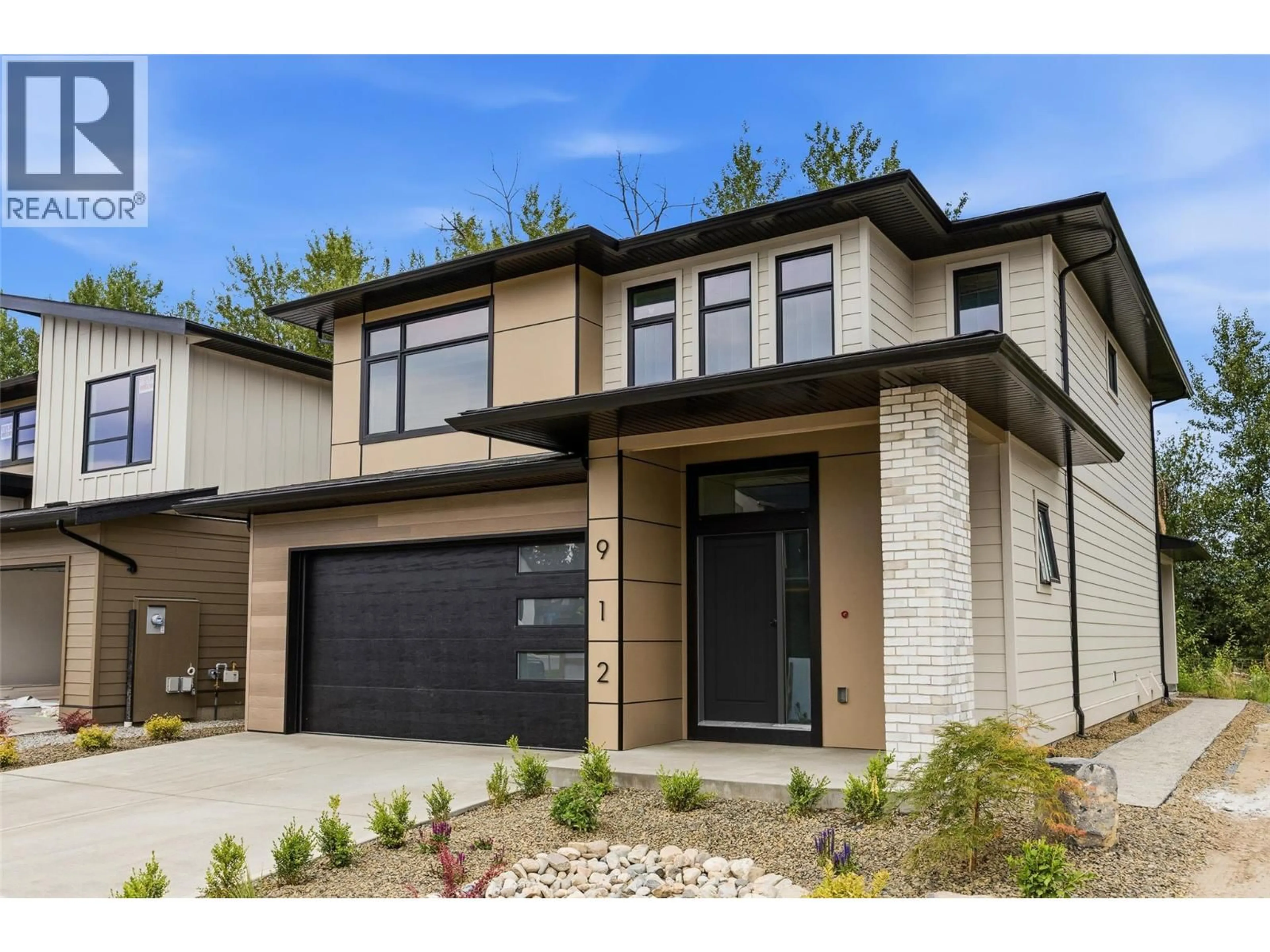 Home with brick exterior material, street for 912 BULL CRESCENT, Kelowna British Columbia V1W4N2