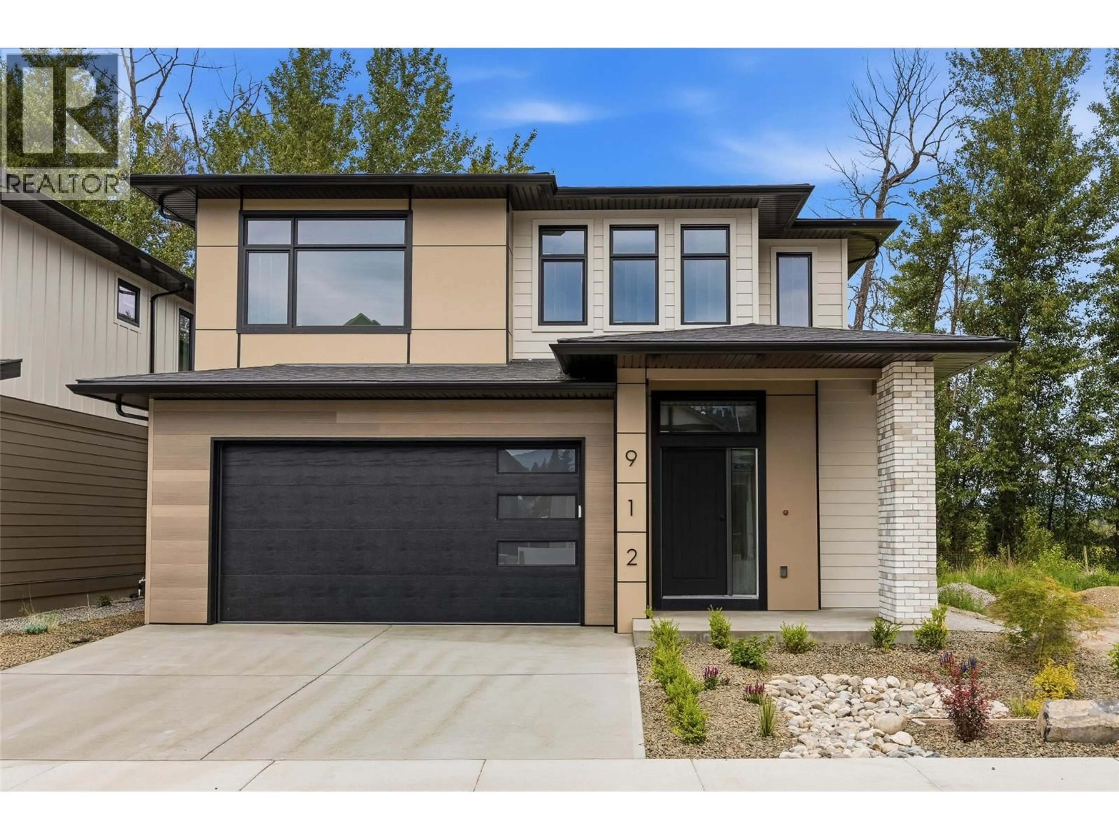Home with brick exterior material, street for 912 BULL CRESCENT, Kelowna British Columbia V1W4N2