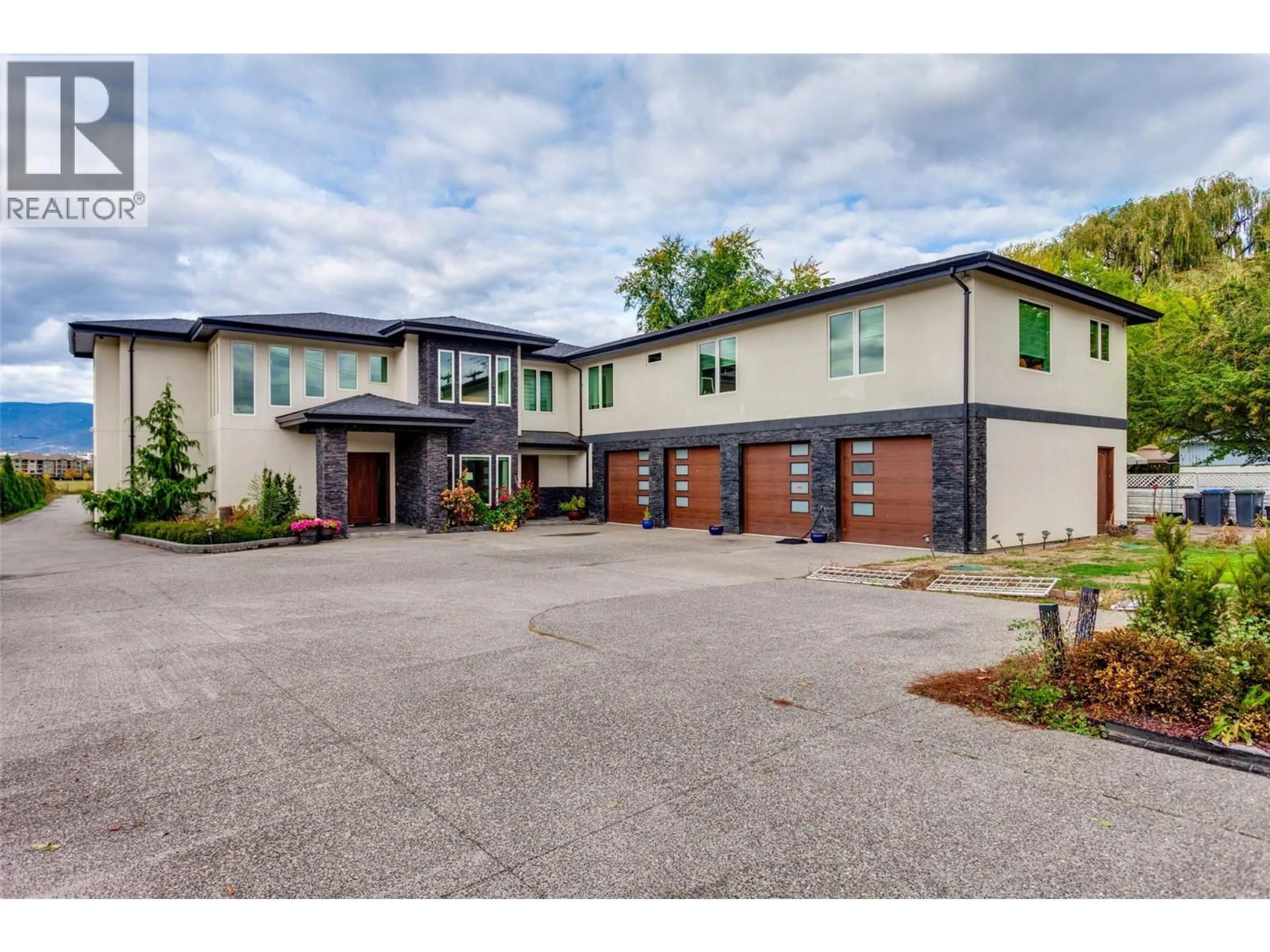 Home with brick exterior material, street for 3666 BENVOULIN ROAD, Kelowna British Columbia V1W4M7