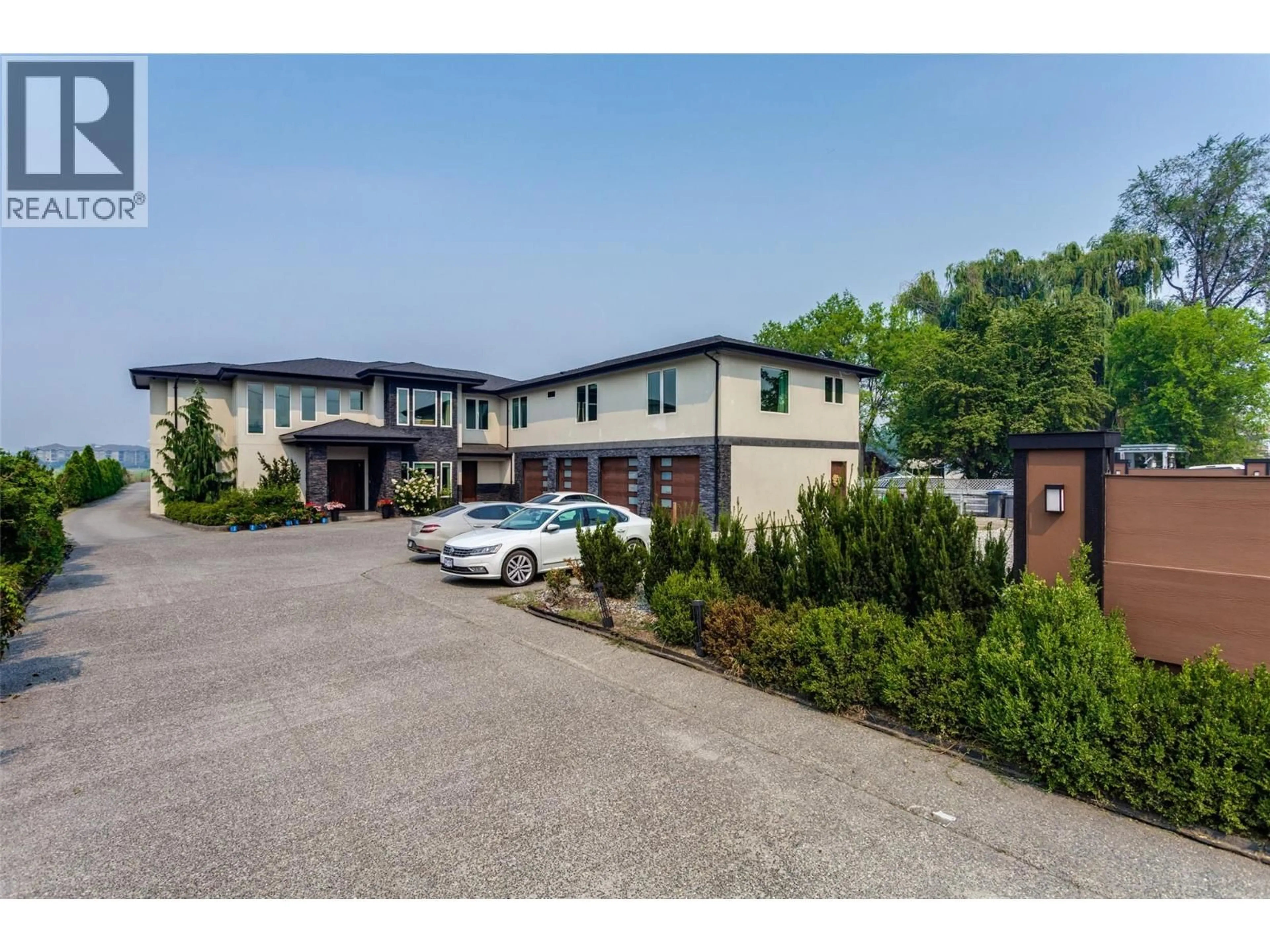 A pic from outside/outdoor area/front of a property/back of a property/a pic from drone, unknown for 3666 BENVOULIN ROAD, Kelowna British Columbia V1W4M7