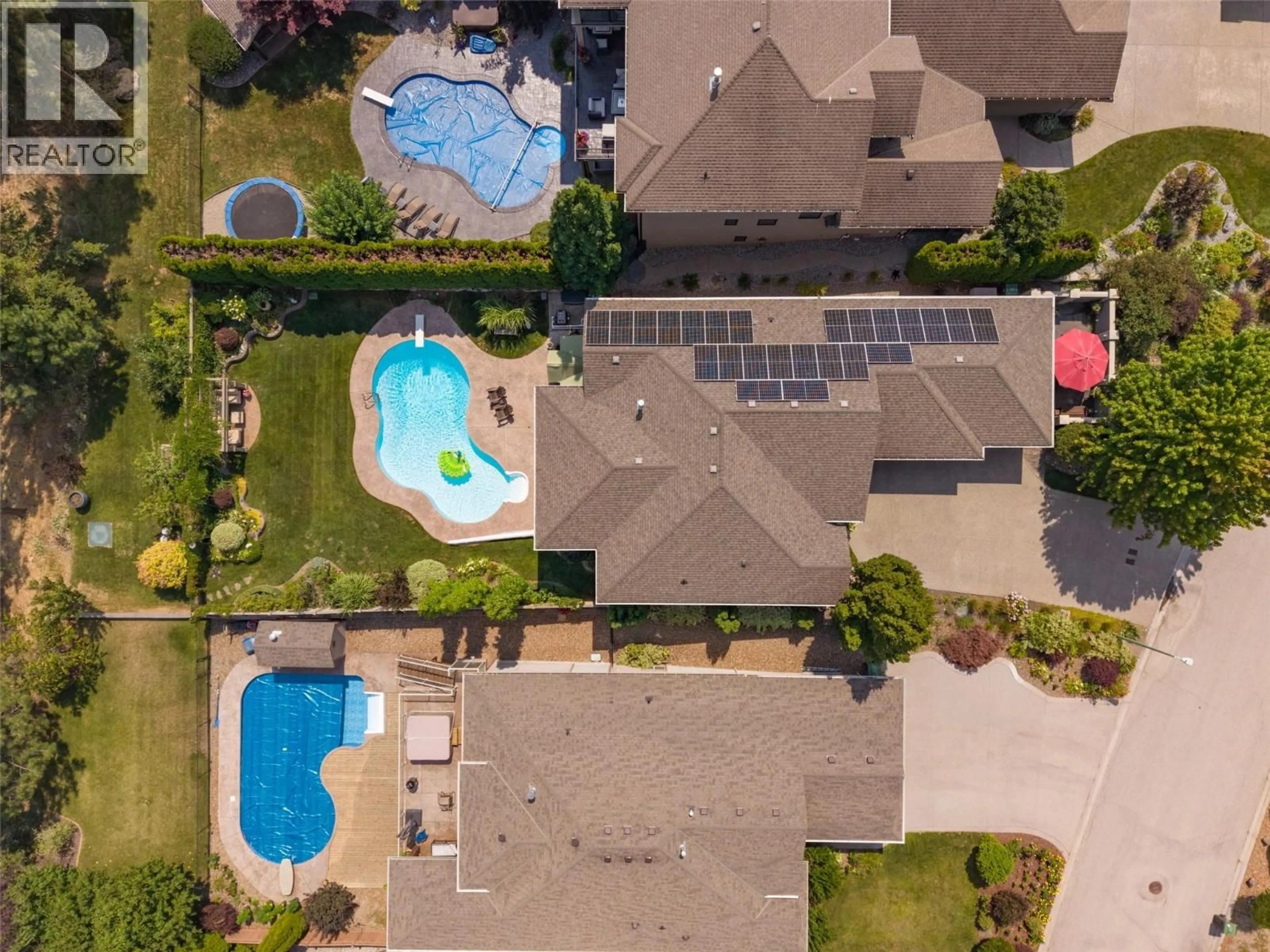 A pic from outside/outdoor area/front of a property/back of a property/a pic from drone, street for 2233 QUAIL RUN DRIVE, Kelowna British Columbia V1V2N5
