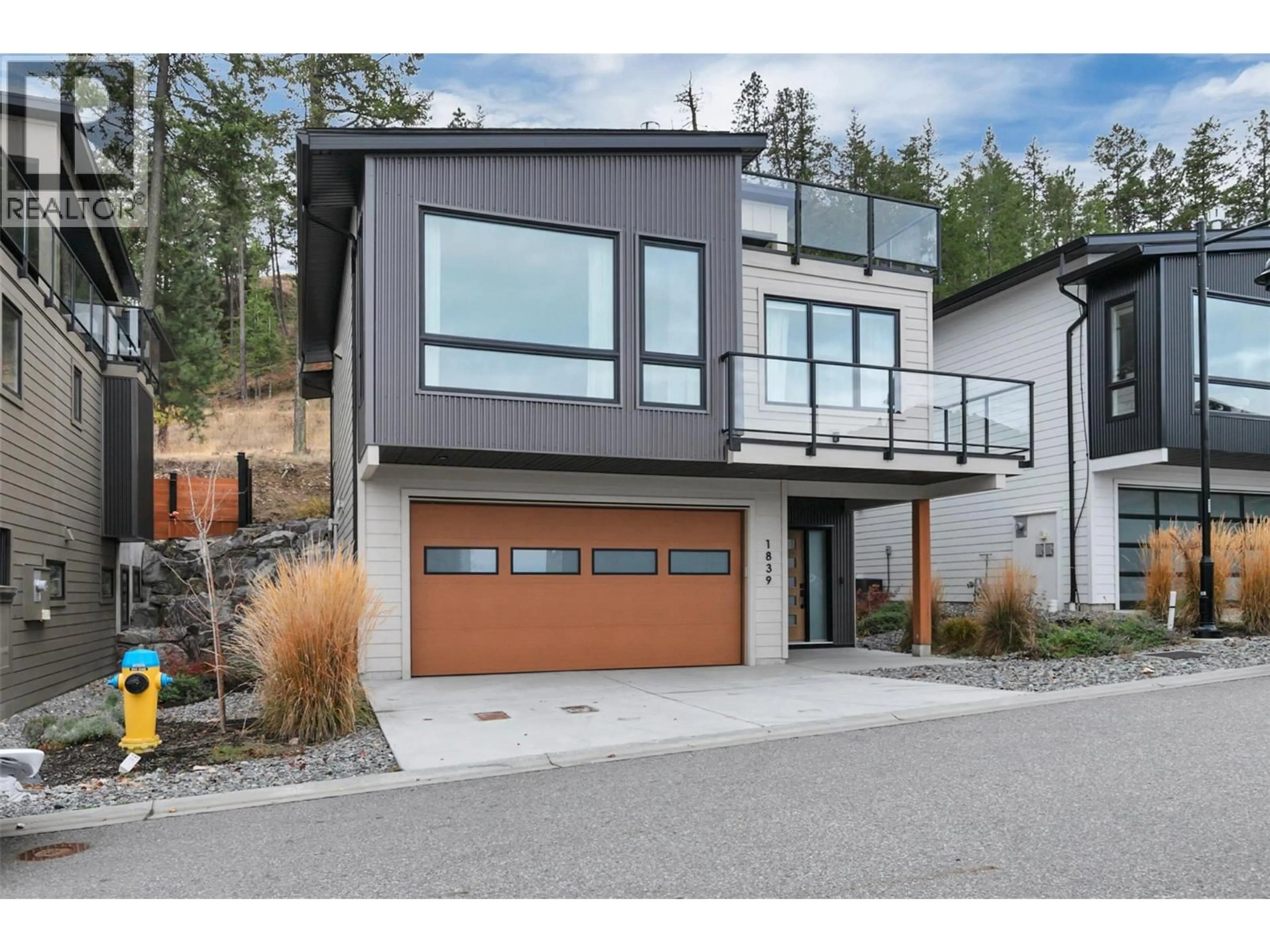 Home with brick exterior material, street for 1839 GREY OWL COURT, Kelowna British Columbia V1V0C6