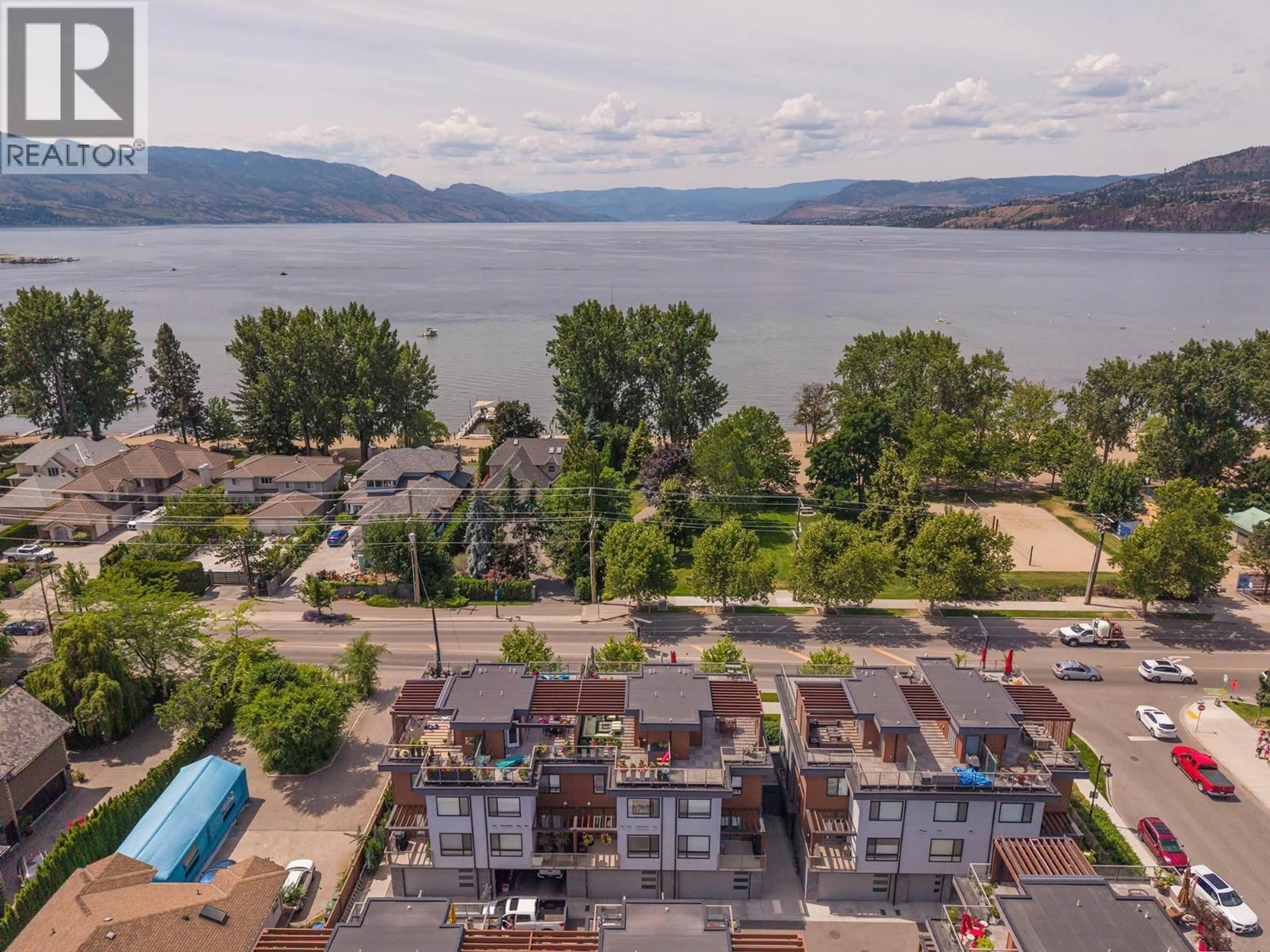 A pic from outside/outdoor area/front of a property/back of a property/a pic from drone, water/lake/river/ocean view for 3 - 3510 LANDIE ROAD, Kelowna British Columbia V1W3E9