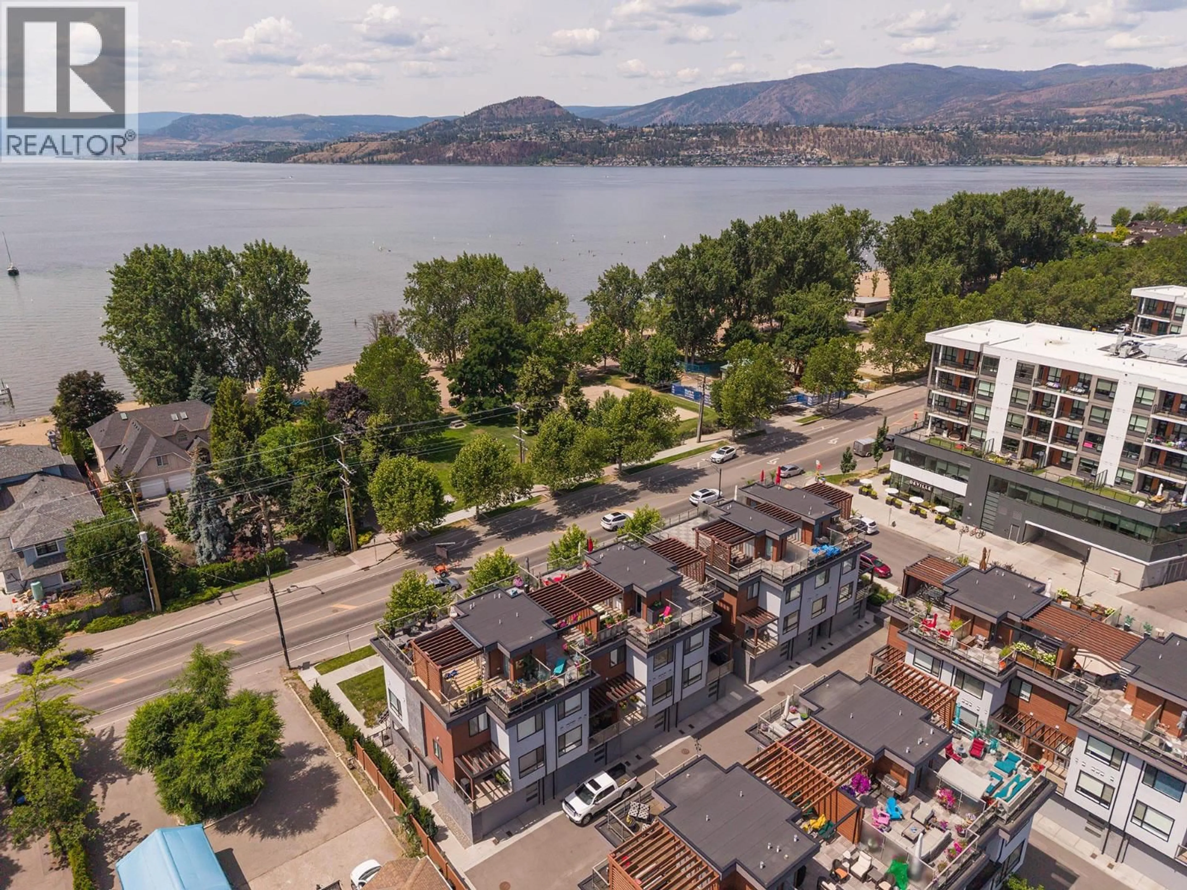 A pic from outside/outdoor area/front of a property/back of a property/a pic from drone, water/lake/river/ocean view for 3 - 3510 LANDIE ROAD, Kelowna British Columbia V1W3E9