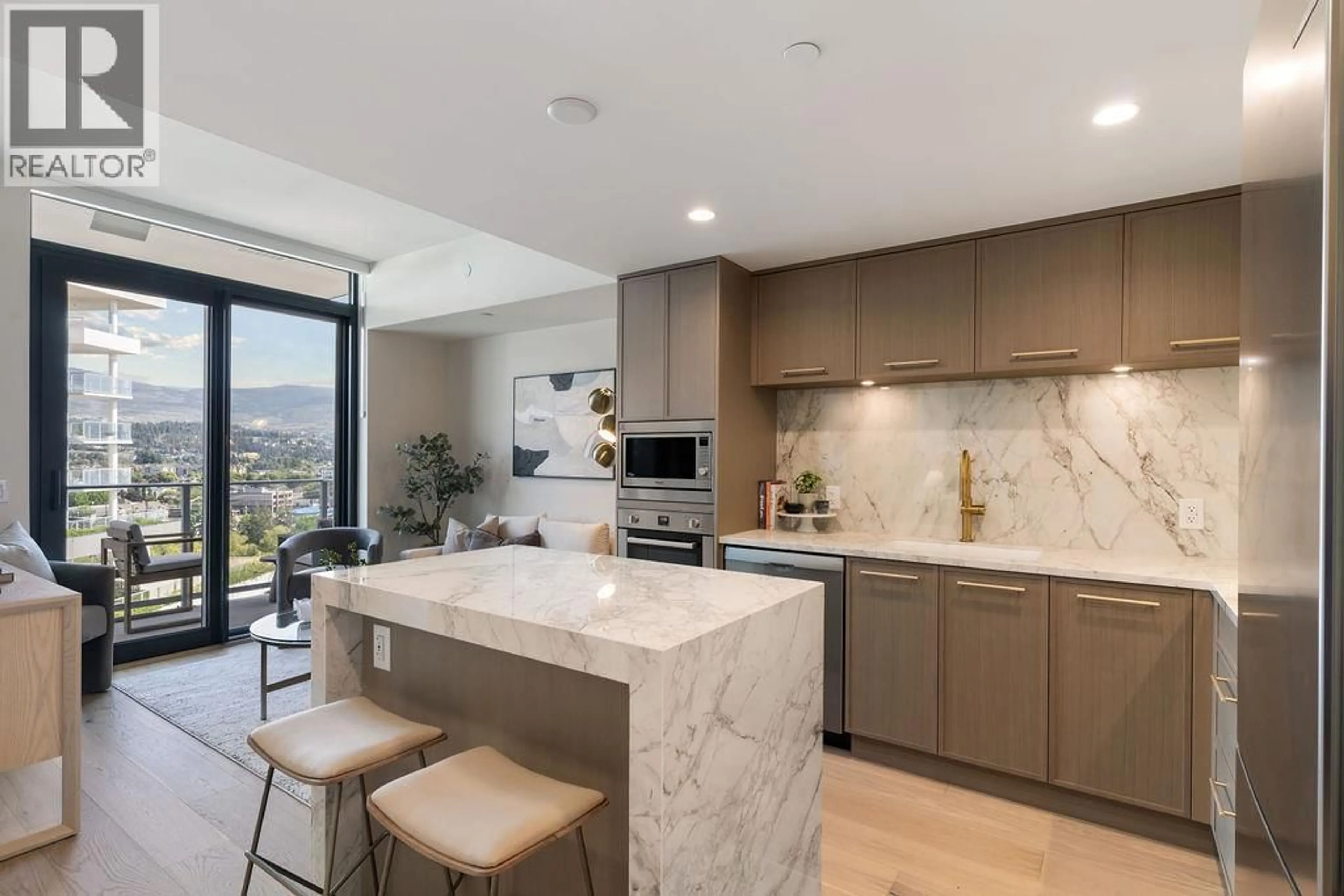 Open concept kitchen, ceramic/tile floor for 1207 - 3700 CAPOZZI ROAD, Kelowna British Columbia V1W0J5