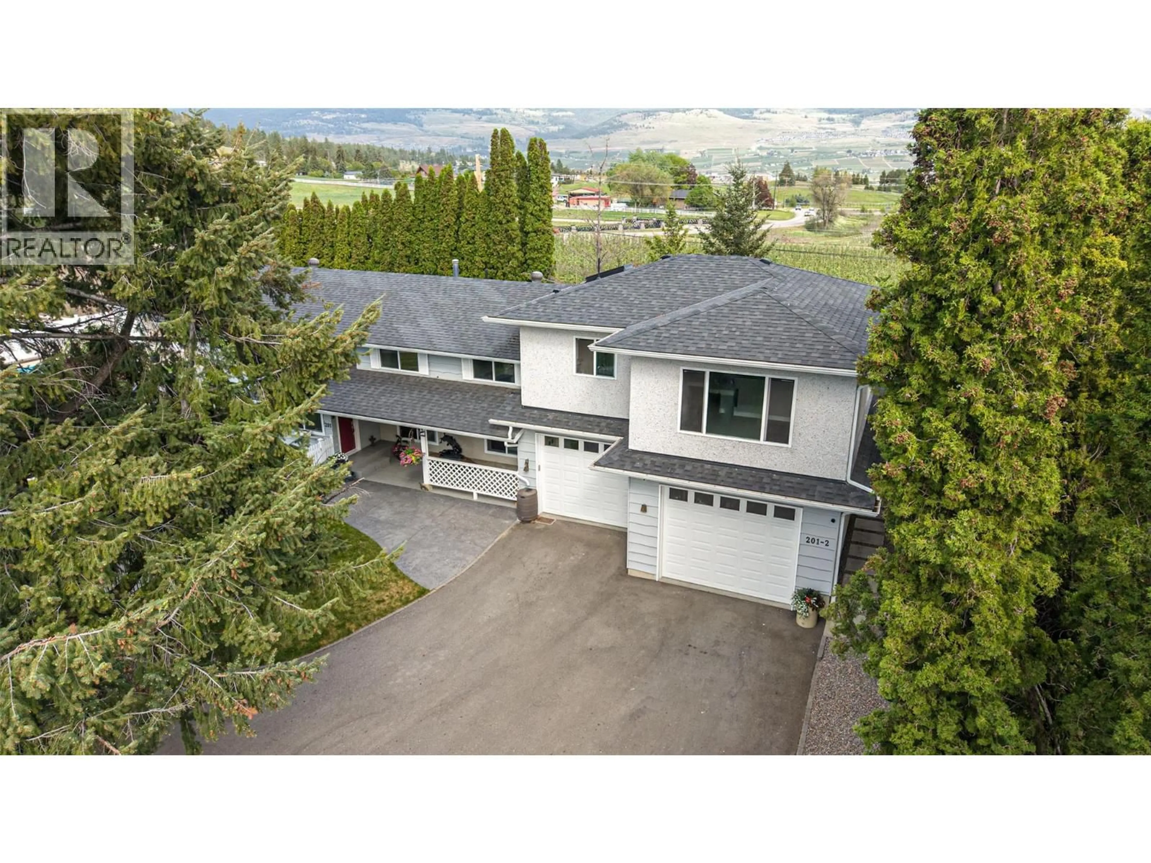 A pic from outside/outdoor area/front of a property/back of a property/a pic from drone, unknown for 201 MAIL ROAD, Kelowna British Columbia V1V2G6