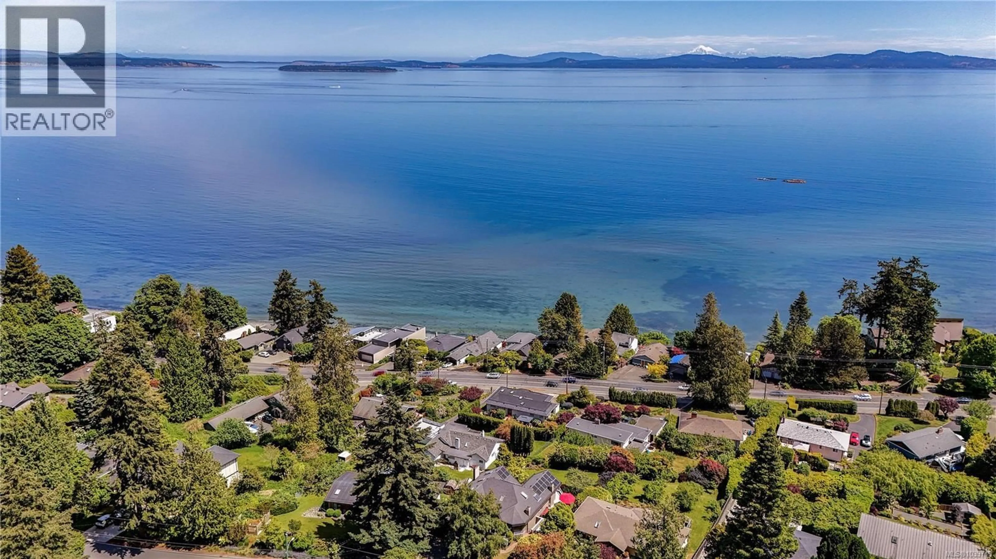A pic from outside/outdoor area/front of a property/back of a property/a pic from drone, water/lake/river/ocean view for 4961 LOCHSIDE DRIVE, Saanich British Columbia V8Y2E6