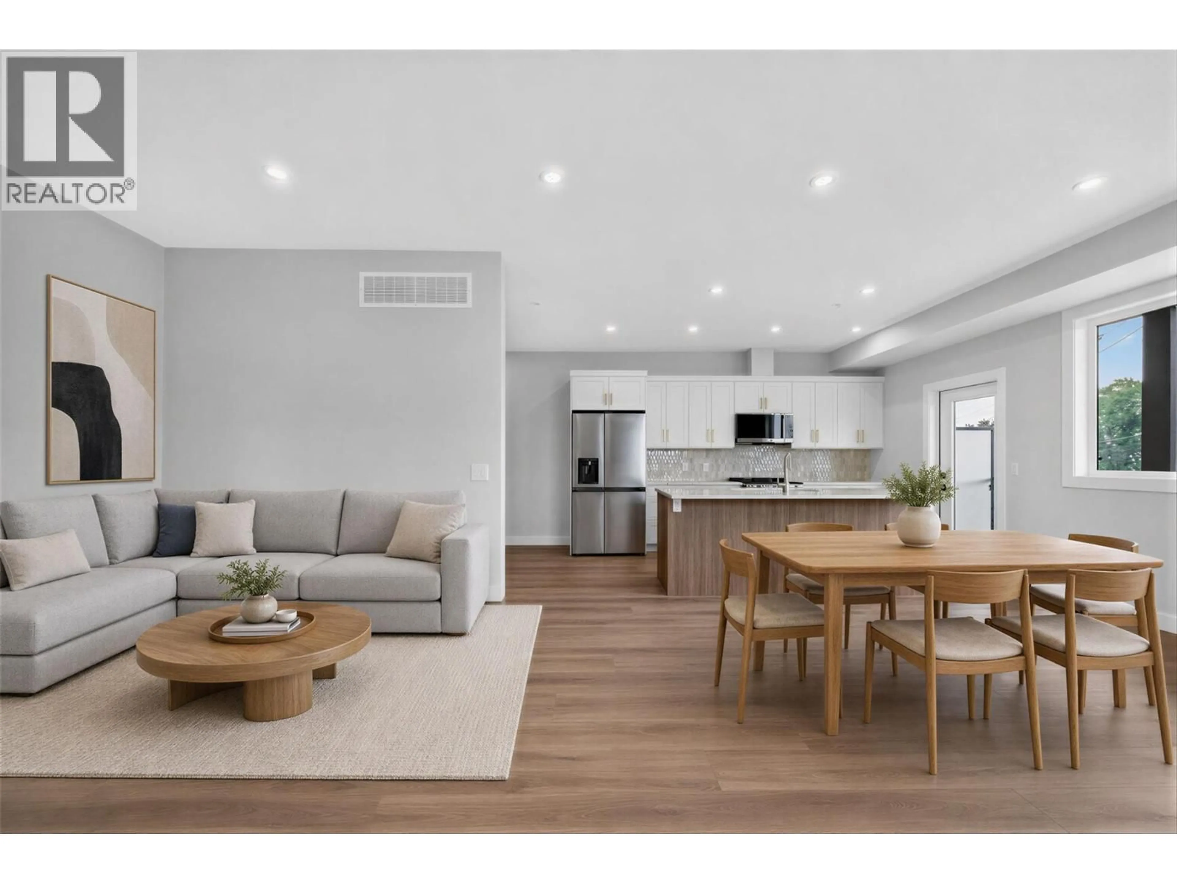 Open concept kitchen, wood/laminate floor for 3 - 2009 39 AVENUE, Vernon British Columbia V1T8E5
