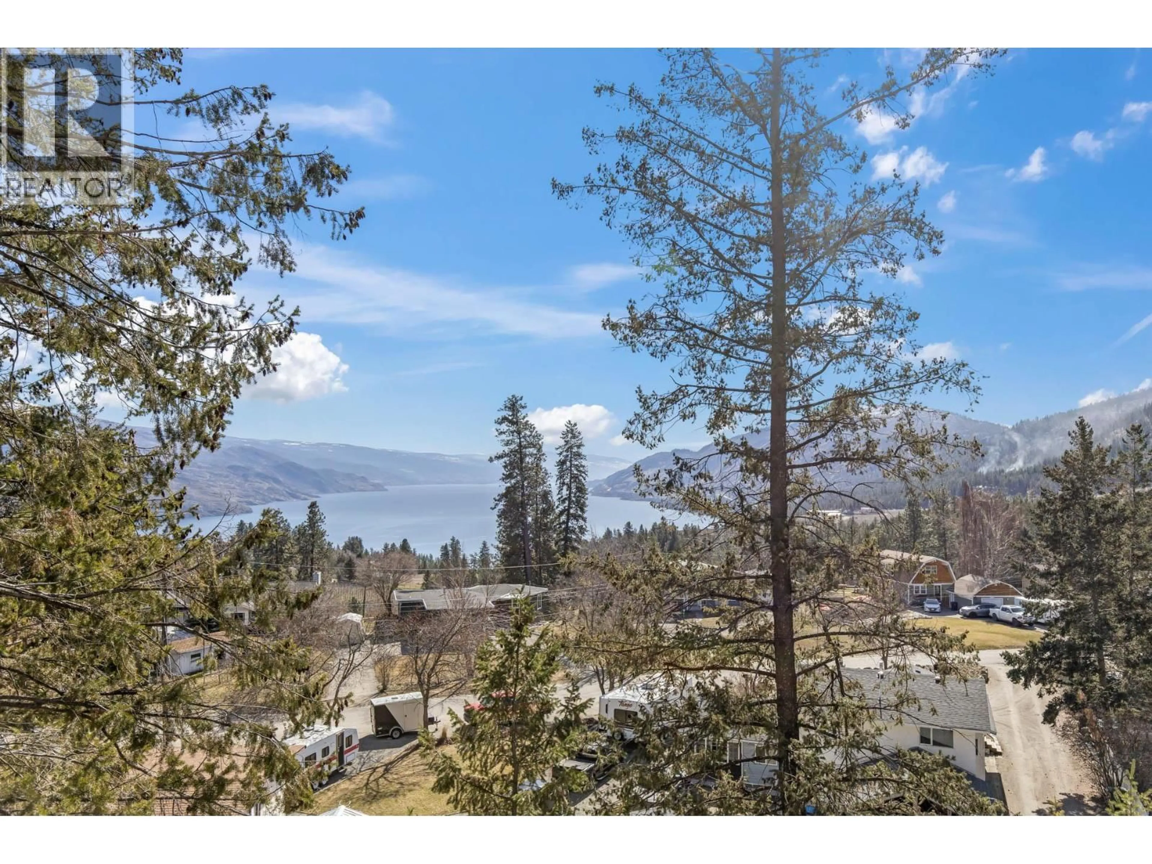 A pic from outside/outdoor area/front of a property/back of a property/a pic from drone, forest/trees view for 6333 FOREST HILL DRIVE, Peachland British Columbia V0H1X8