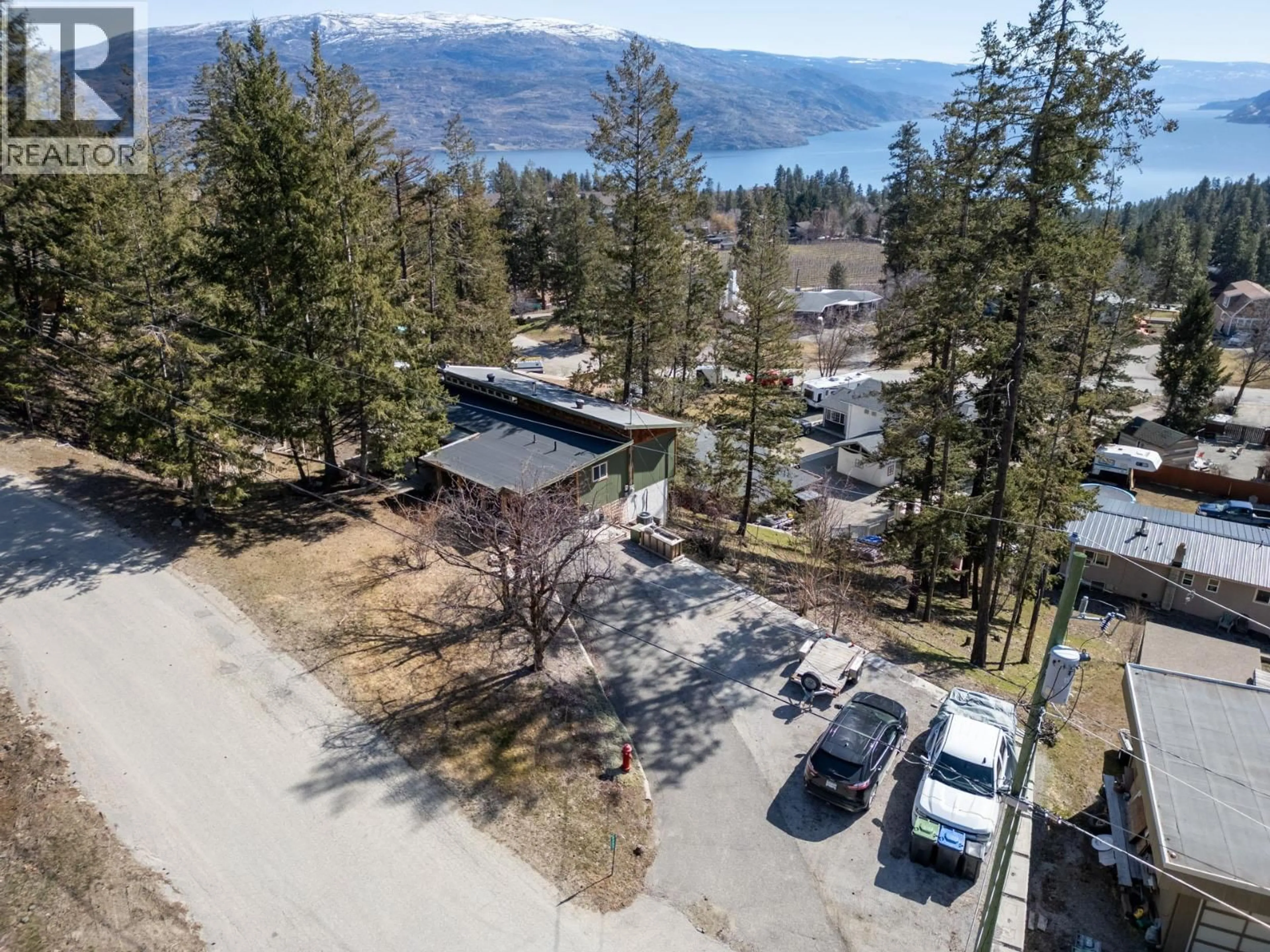 A pic from outside/outdoor area/front of a property/back of a property/a pic from drone, mountain view for 6333 FOREST HILL DRIVE, Peachland British Columbia V0H1X8