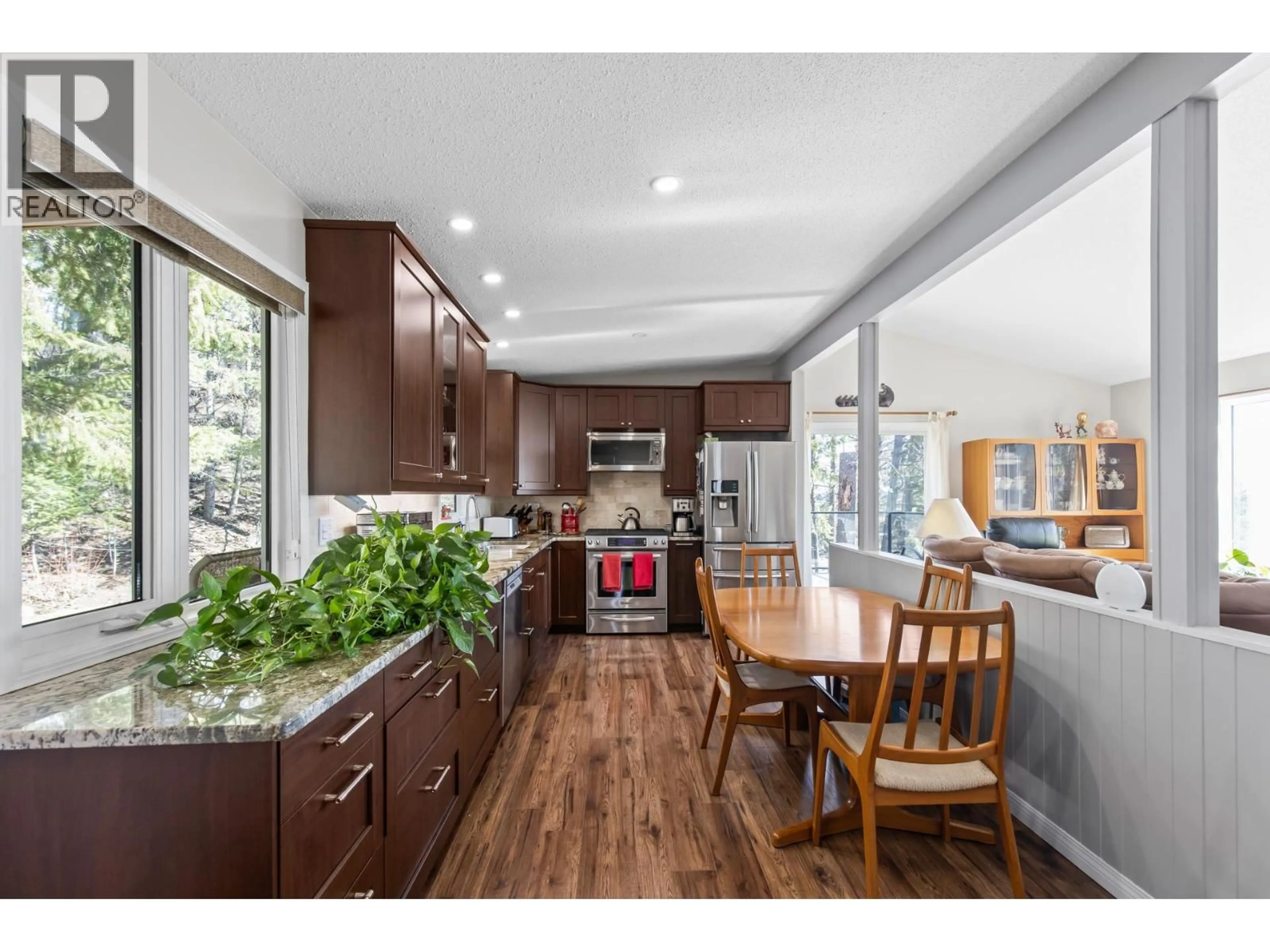 Open concept kitchen, wood/laminate floor for 6333 FOREST HILL DRIVE, Peachland British Columbia V0H1X8