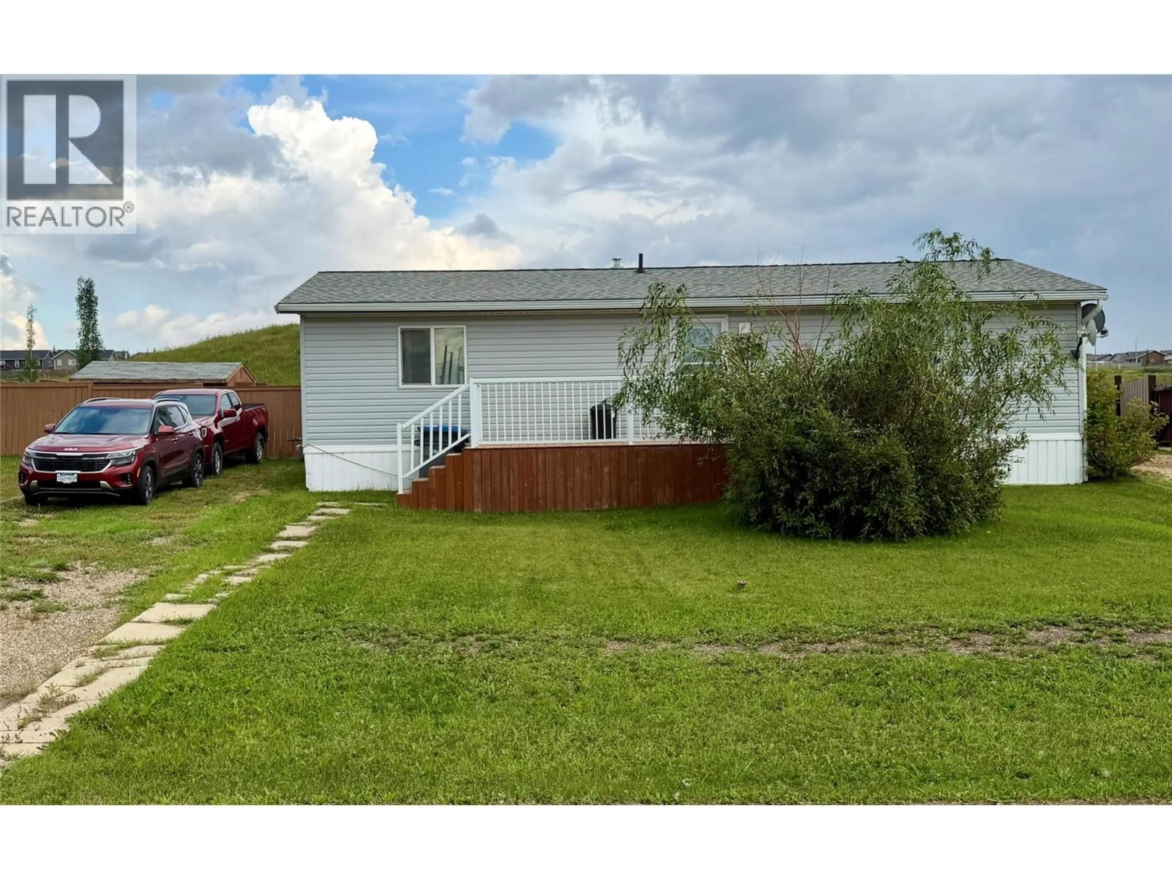 A pic from outside/outdoor area/front of a property/back of a property/a pic from drone, unknown for 8416 21 STREET, Dawson Creek British Columbia V1G0G7