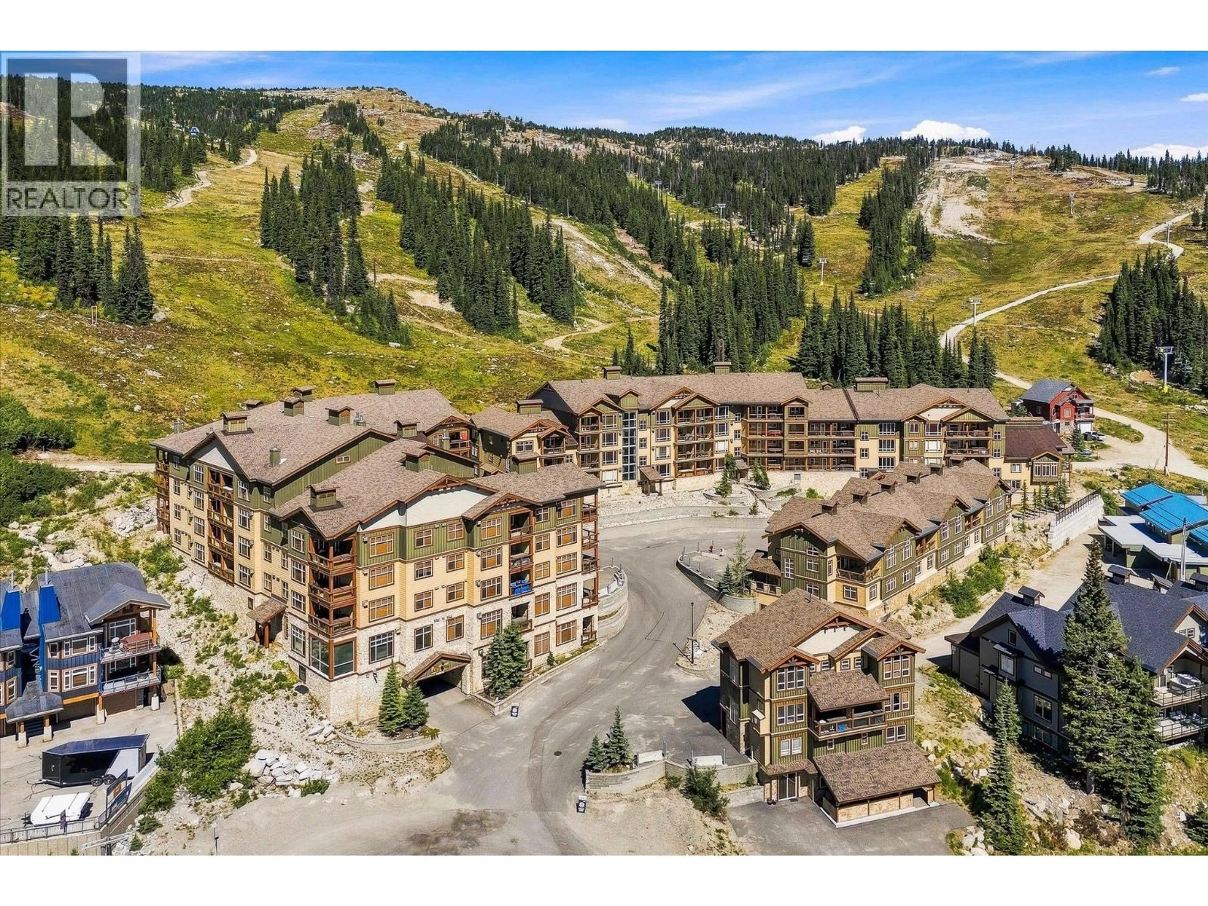 A pic from outside/outdoor area/front of a property/back of a property/a pic from drone, mountain view for 4 - 304 - 7700 PORCUPINE ROAD, Big White British Columbia V1P1T4