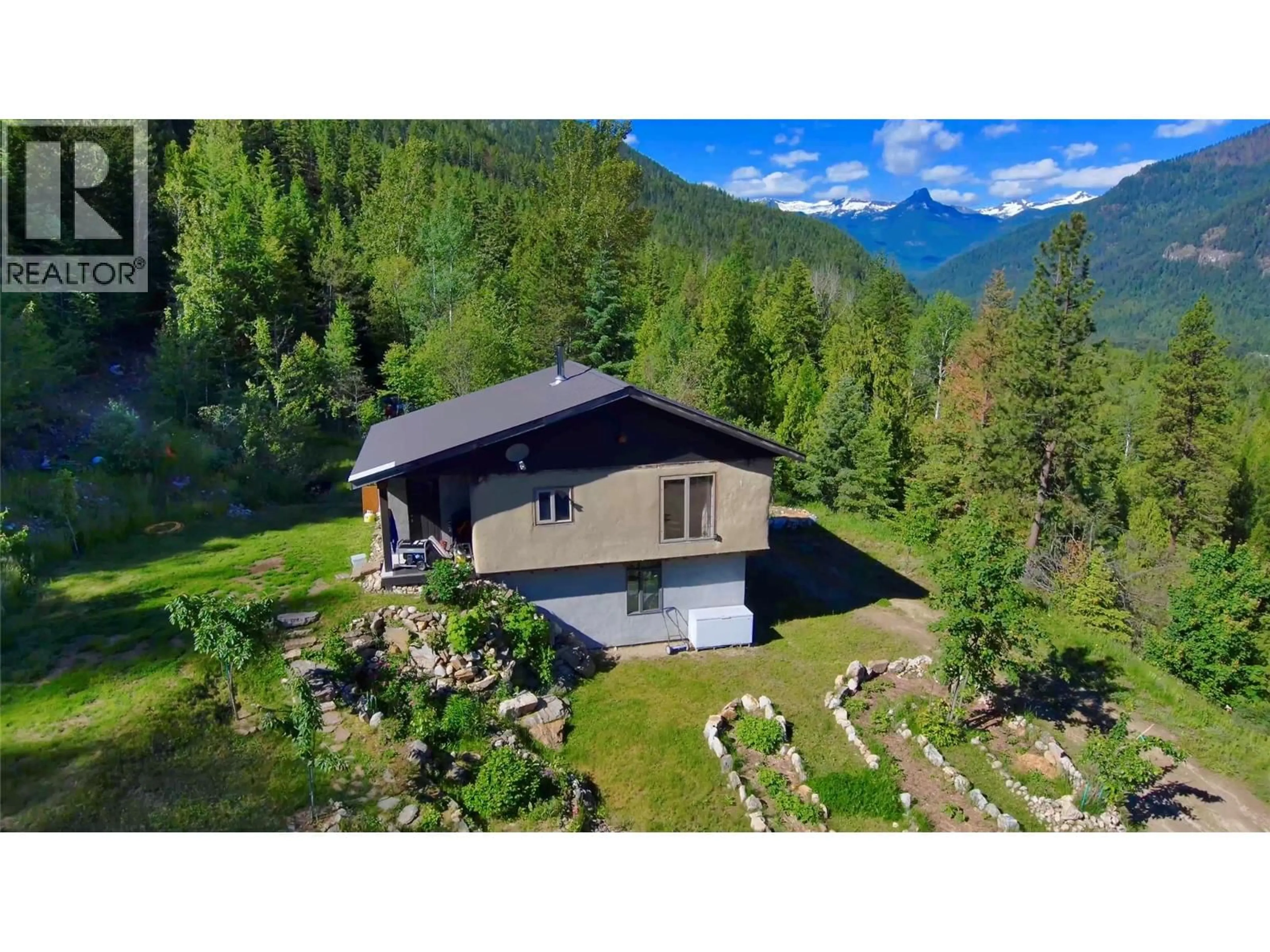 A pic from outside/outdoor area/front of a property/back of a property/a pic from drone, mountain view for 4650 6 HIGHWAY, Winlaw British Columbia V0G2J0