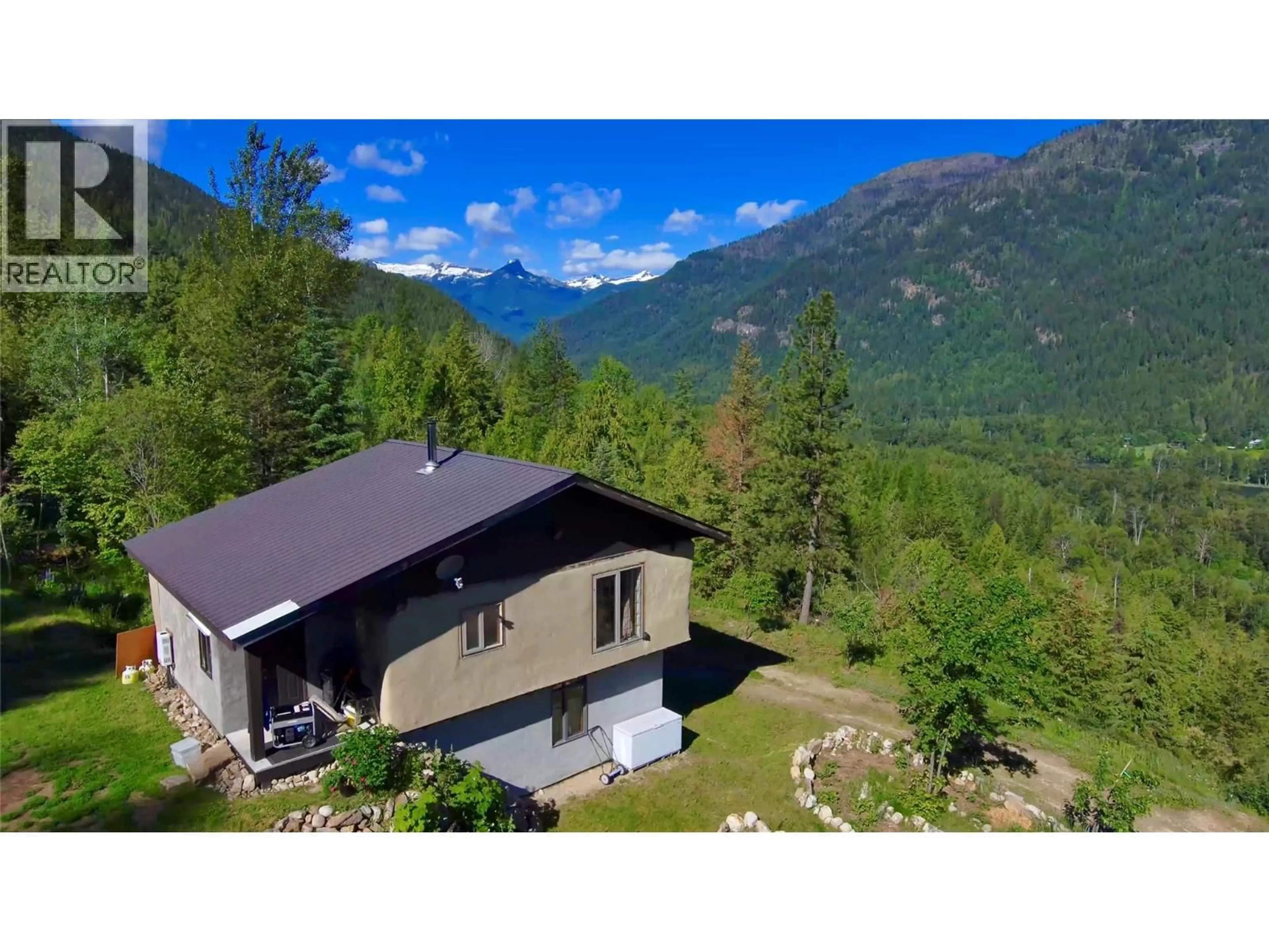 A pic from outside/outdoor area/front of a property/back of a property/a pic from drone, mountain view for 4650 6 HIGHWAY, Winlaw British Columbia V0G2J0